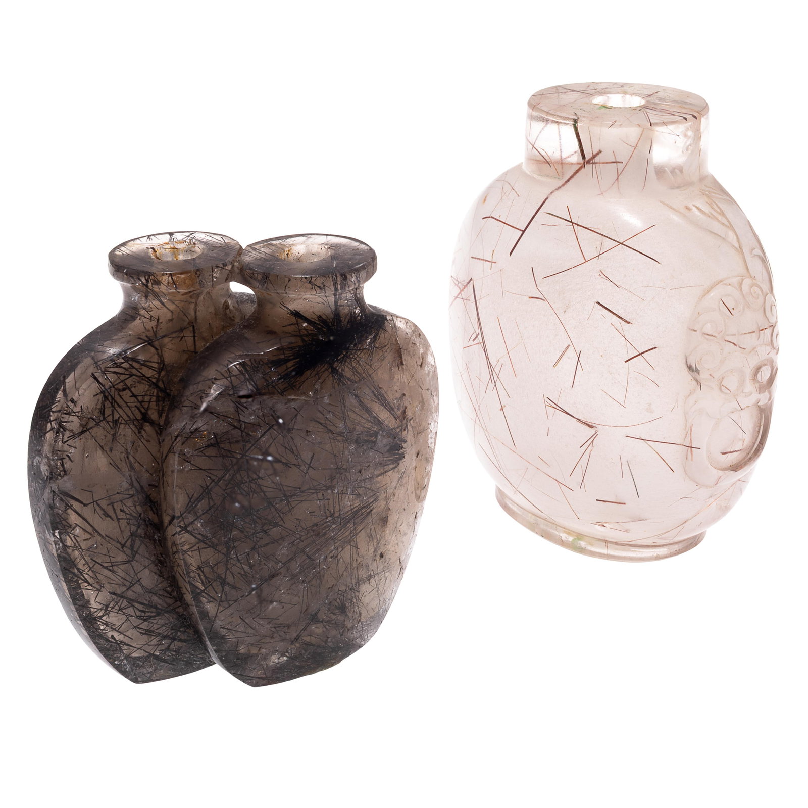 Pair of Rutilated Quartz Snuff Bottles: Pair of Rutilated Quartz Snuff Bottles One bottle a double bottle, both with 'angel hair' inclusions. 3in and 2in (7.5cm and 5c)