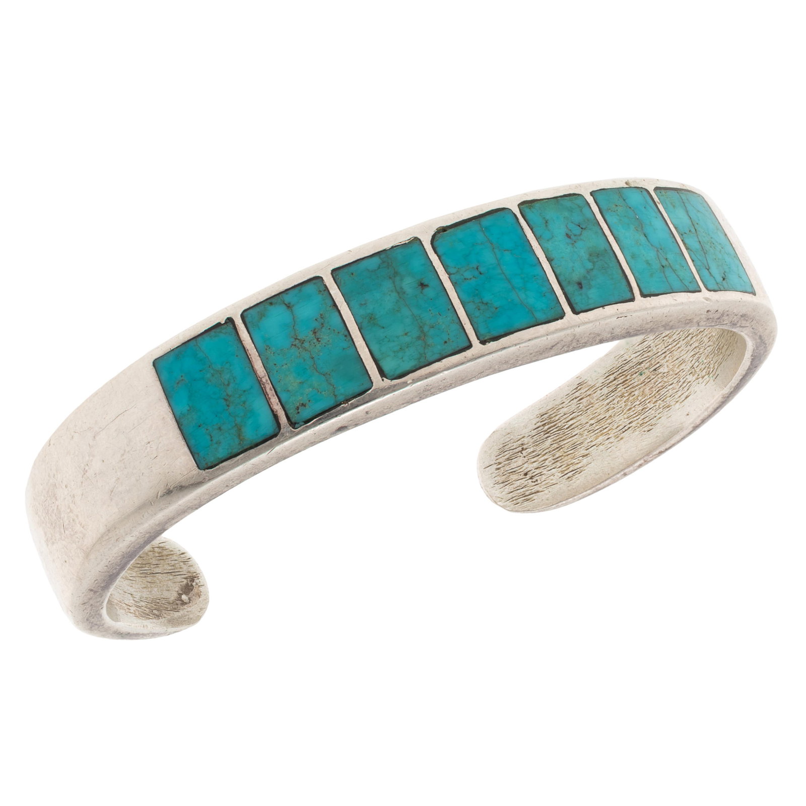 Turquoise, Sterling Cuff Bracelet, Ted Charveze, Isleta: Turquoise, Sterling Cuff Bracelet, Ted Charveze, Isleta Featuring seven inlaid turquoise plaques set in a sterling silver cuff bracelet measuring approximately 12.0 mm in width, inner circumference 6 