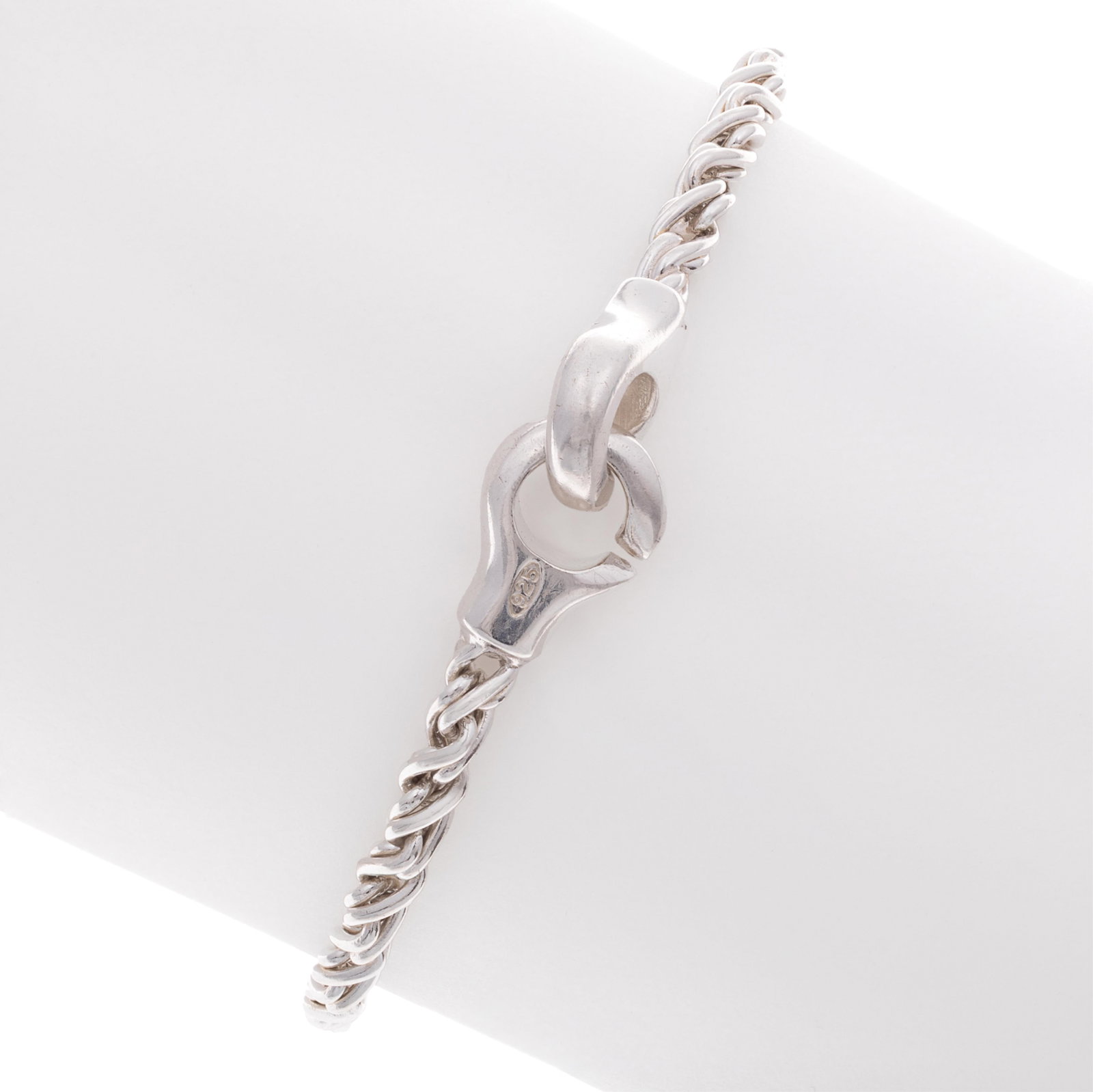 Tiffany & Co. Sterling Silver Bracelet: Tiffany & Co. Sterling Silver Bracelet The sterling silver twisted rope links measuring approximately 3.7 mm in width, completed by two interlocking clasps forming a 7 1/2 inch bracelet. Marked 'T & C