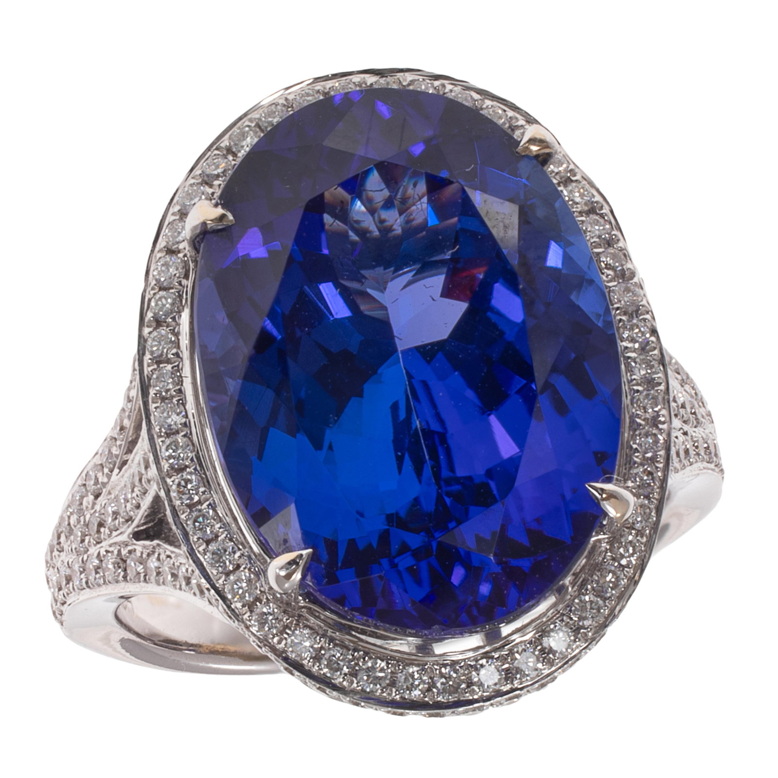 Tanzanite, Diamond, 18k White Gold Ring: Tanzanite, Diamond, 18k White Gold Ring Centering one oval-cut tanzanite weighing approximately 10.65 cts., accented by numerous round brilliant-cut diamonds weighing a total of approximately 0.80