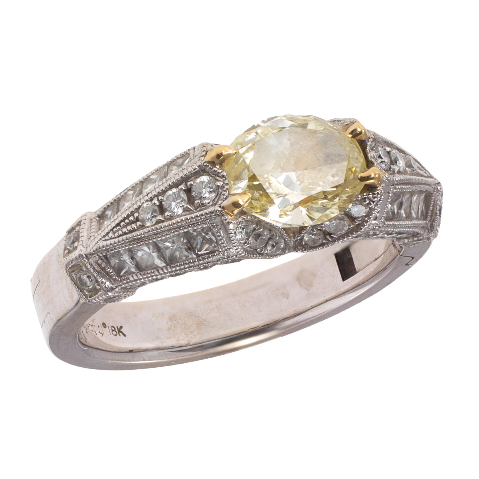 Colored Diamond, Diamond, 18k White Gold Ring: Colored Diamond, Diamond, 18k White Gold Ring Centering an oval-cut yellow diamond weighing approximately 0.90 ct., accented by sixty-two full and princess-cut diamonds weighing a total of