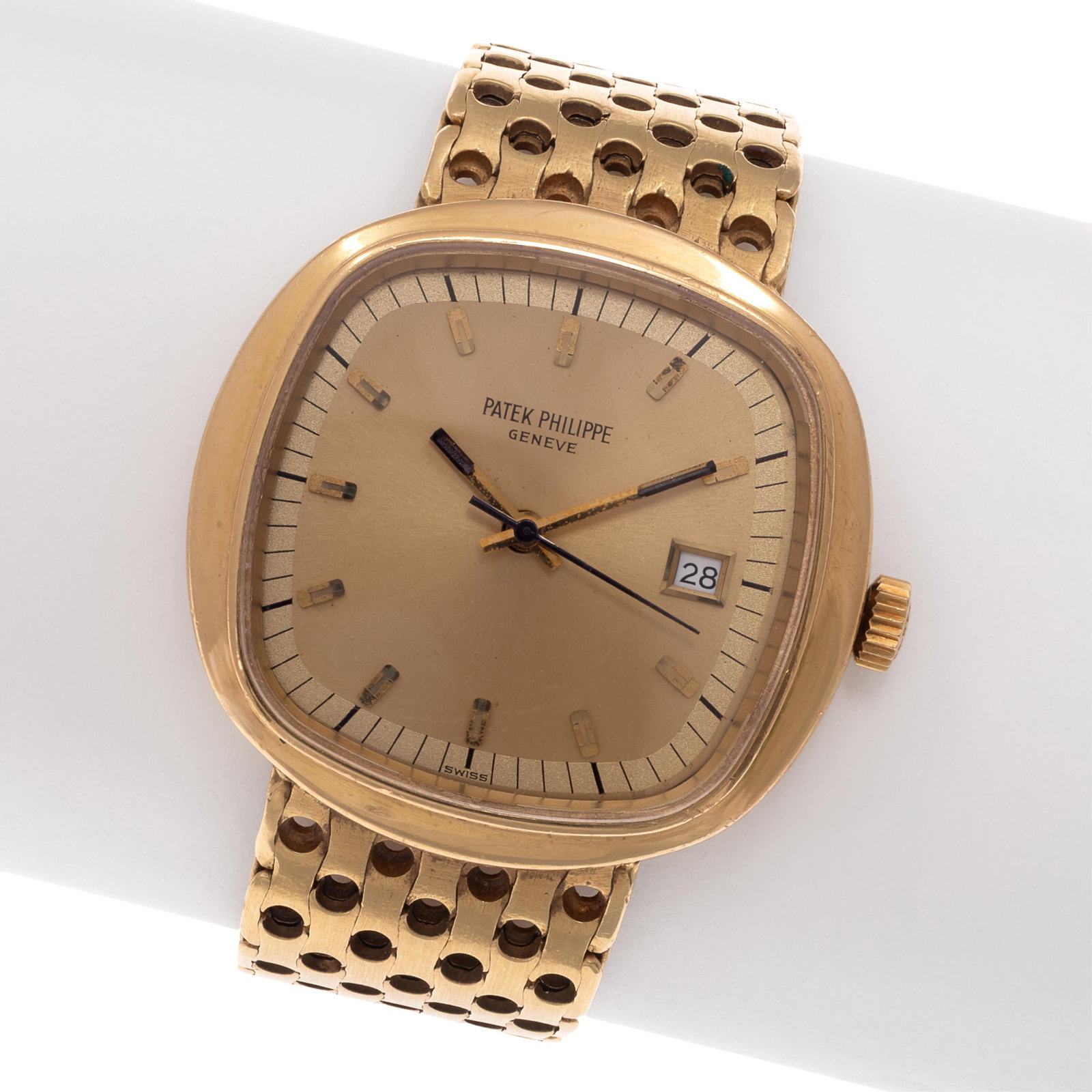 Patek Philippe 'Beta 21' 18k Yellow Gold Wristwatch: Patek Philippe 'Beta 21' 18k Yellow Gold Wristwatch DIAL: Cushion, champagne, applied gilt hour markers, black outer minutes track, luminous baton hands, center seconds sweep, date aperture at 3 o'clo