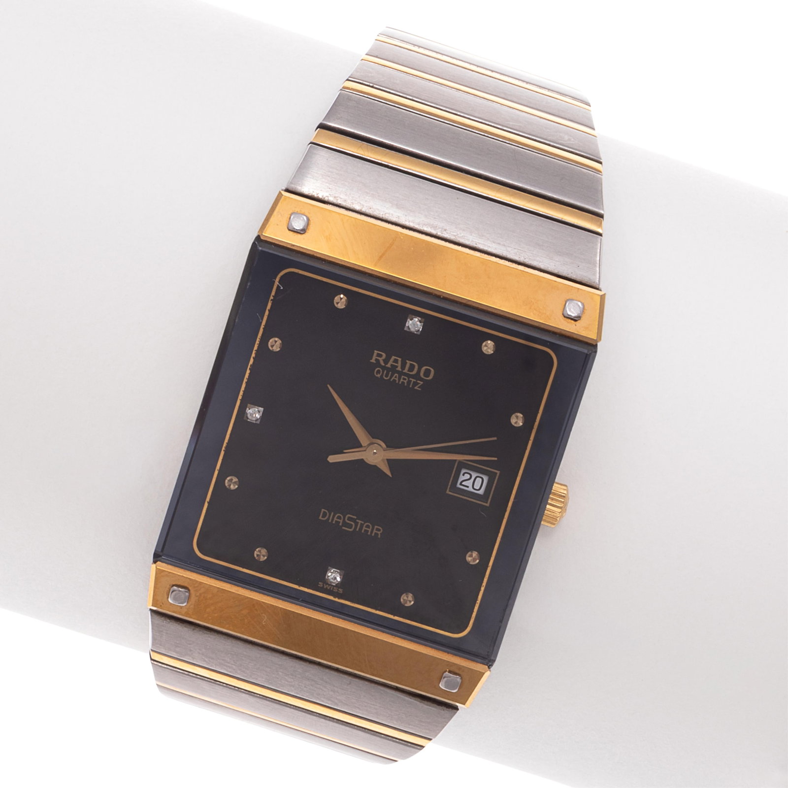 Rado DiaStar Stainless Steel, Gold-Plated Wristwatch: Rado DiaStar Stainless Steel, Gold-Plated Wristwatch DIAL: Rectangle, black, diamond and dot hour markers, gold-tone dauphine hands, center seconds sweep, date aperture at 3 o'clock, Rado, Quartz, Dia