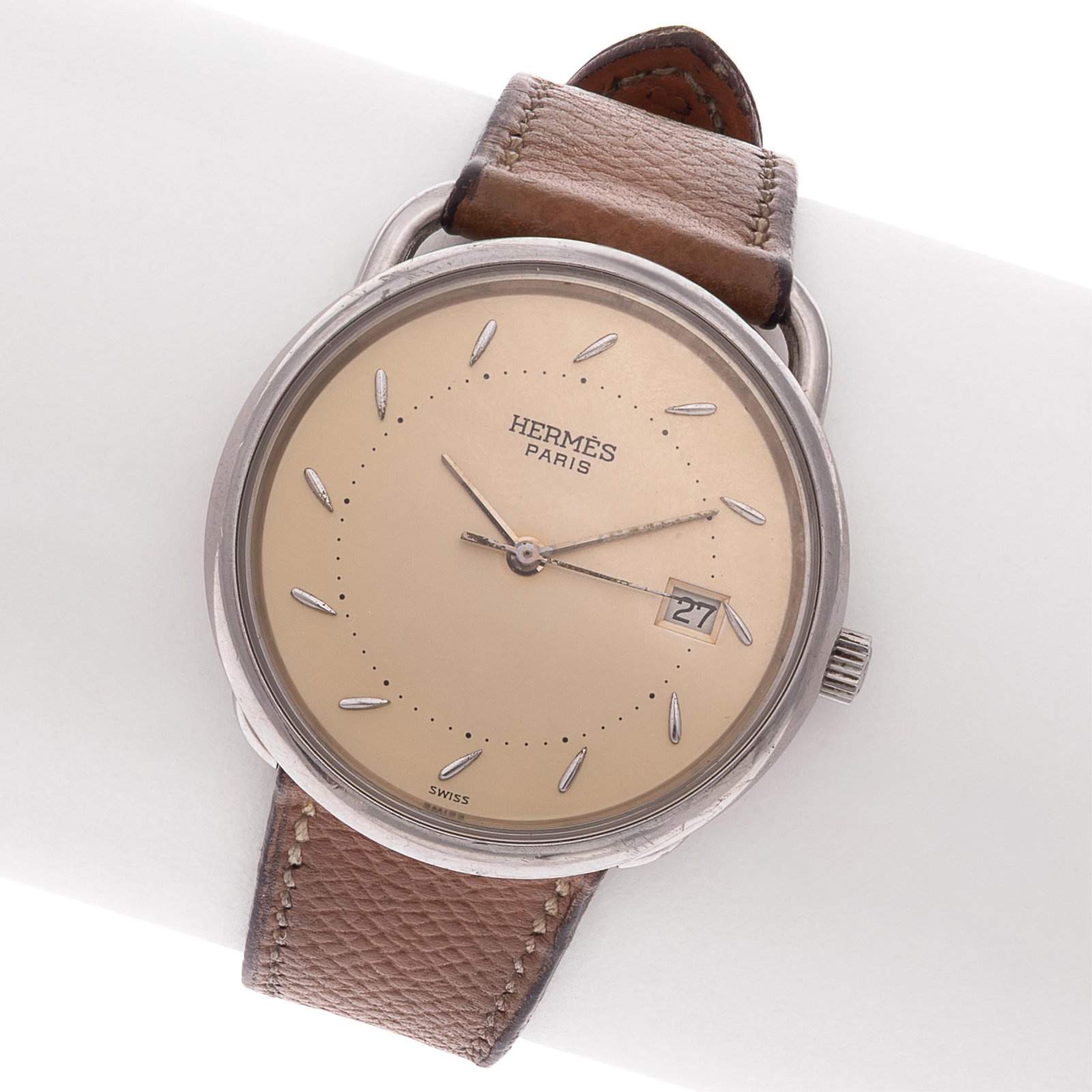 Hermes Arceau Stainless Steel Wristwatch: Hermes Arceau Stainless Steel Wristwatch DIAL: Round, gold, applied silver-tone dash hour markers, silver-tone baton hands, center seconds sweep, date aperture at 3 o'clock, Hermes. MOVEMENT: Quartz, 