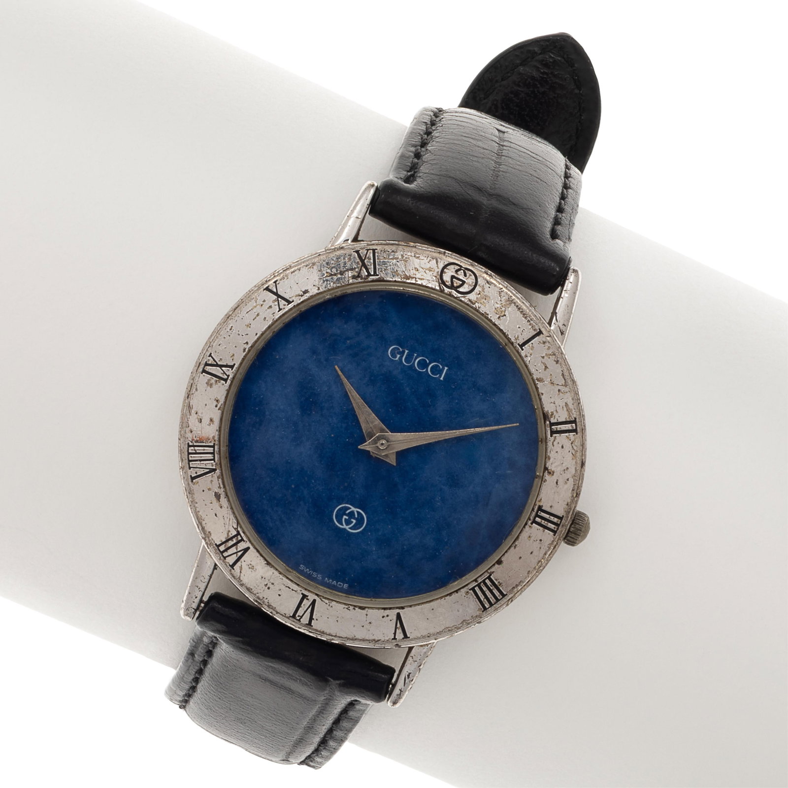 Gucci Lapis Lazuli, Sterling Silver Wristwatch: Gucci Lapis Lazuli, Sterling Silver Wristwatch DIAL: Round, lapis lazuli, Roman numeral hour markers on outer bezel, silver-tone dauphine hands, Gucci. MOVEMENT: Quartz (case not opened). CASE: Round,