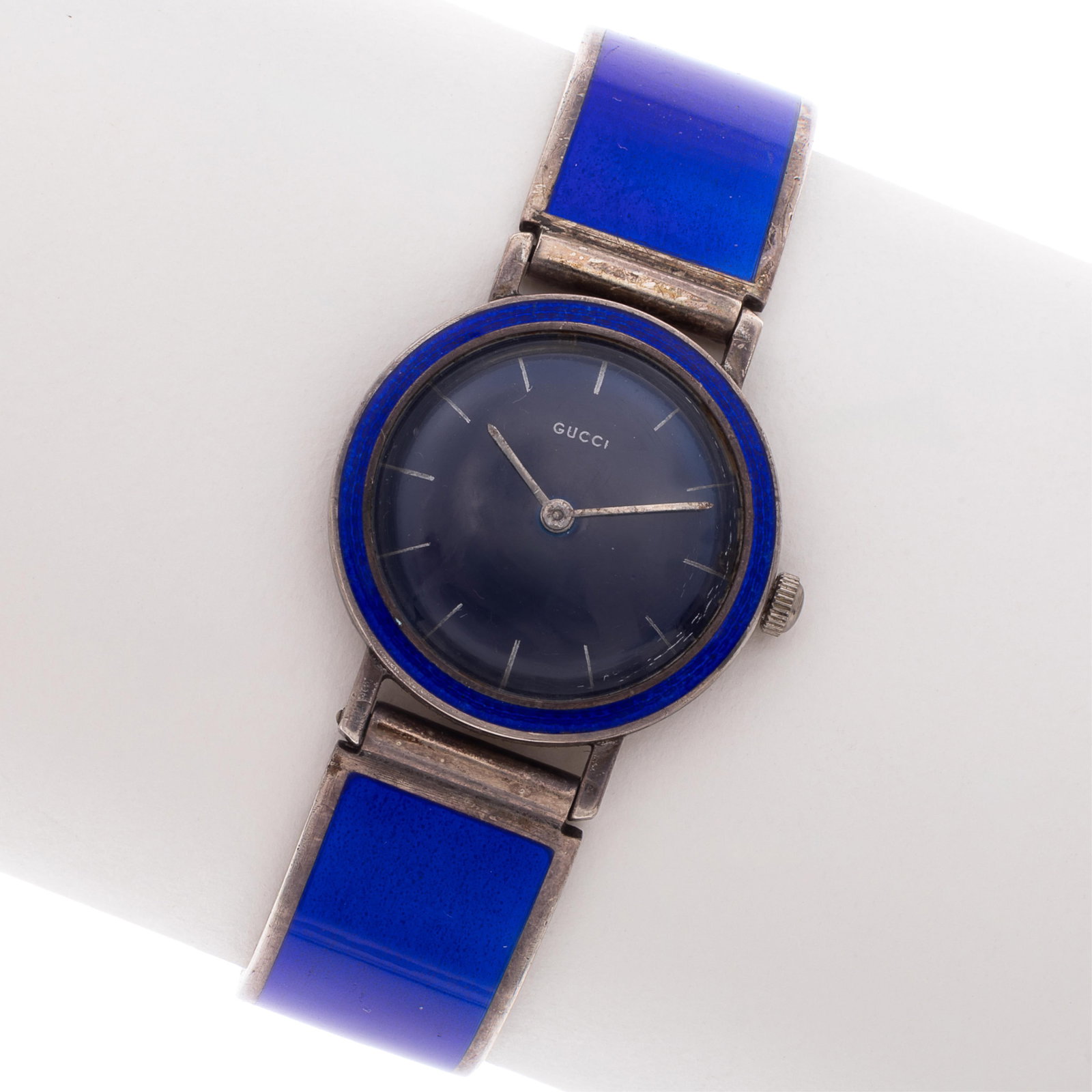 Gucci Enamel, Sterling Silver Bracelet Watch: Gucci Enamel, Sterling Silver Bracelet Watch DIAL: Round, blue, stick hour markers, silver baton hands, Gucci. MOVEMENT: Manual wind (case not opened). CASE: Round, sterling silver with blue enamel, s