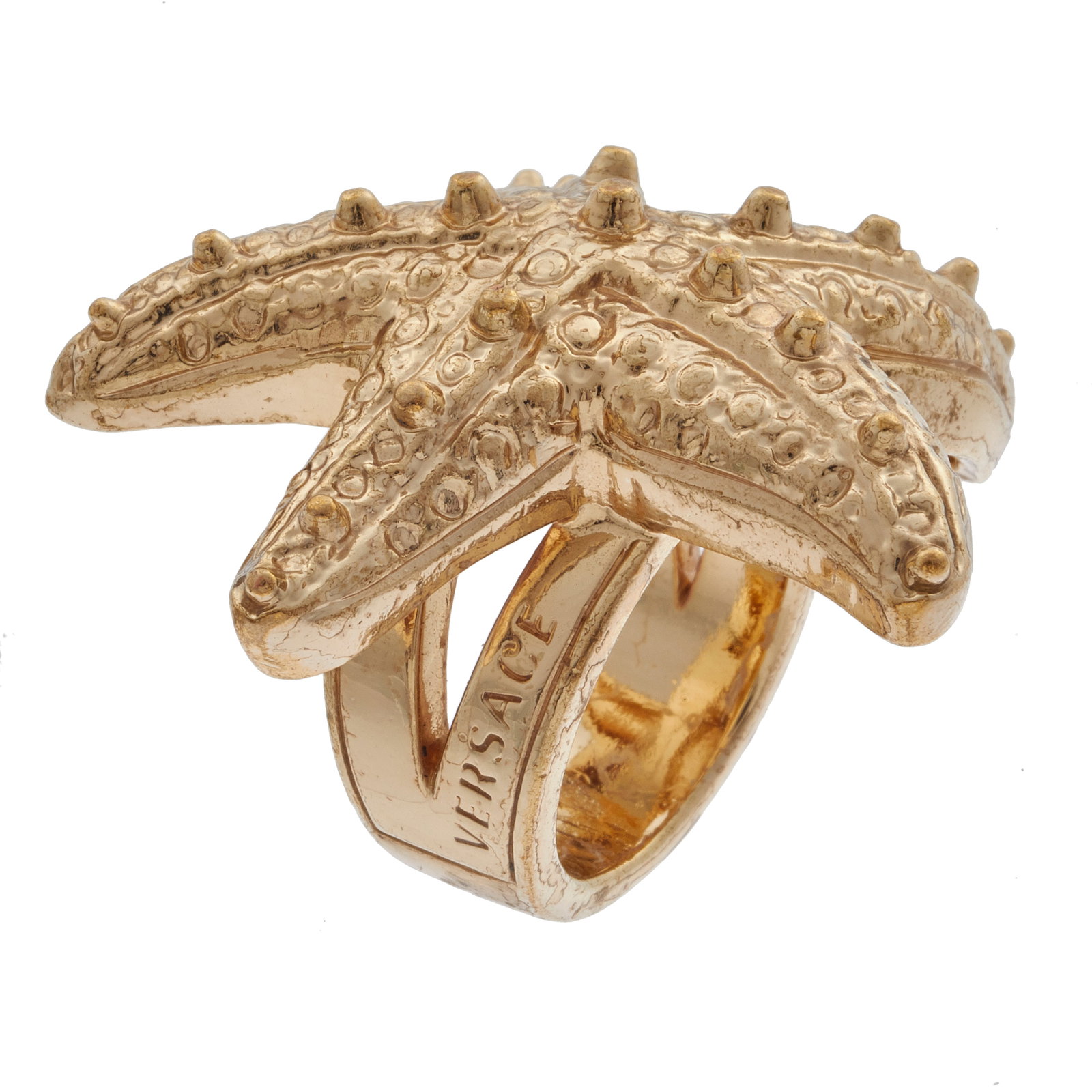 Gianni Versace Starfish Cocktail Ring: Gianni Versace Starfish Cocktail Ring Designed as a starfish measuring approximately 40.0 x 38.0 mm (1.60 x 1.50 in), set in a gold-tone ring mounting, size 7 1/2. Marked "Versace." Gross weight: 36.5
