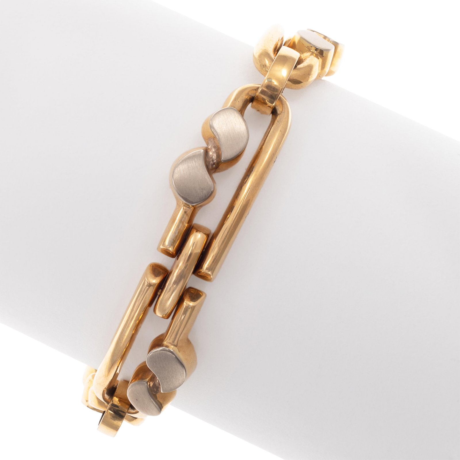 18k Yellow and White gold Bracelet, Donnagemma: 18k Yellow and White gold Bracelet, Donnagemma The 18k yellow gold elongated links, embellished by yellow and white gold paisley-shaped centers, completed by a tongue-and-groove clasp with