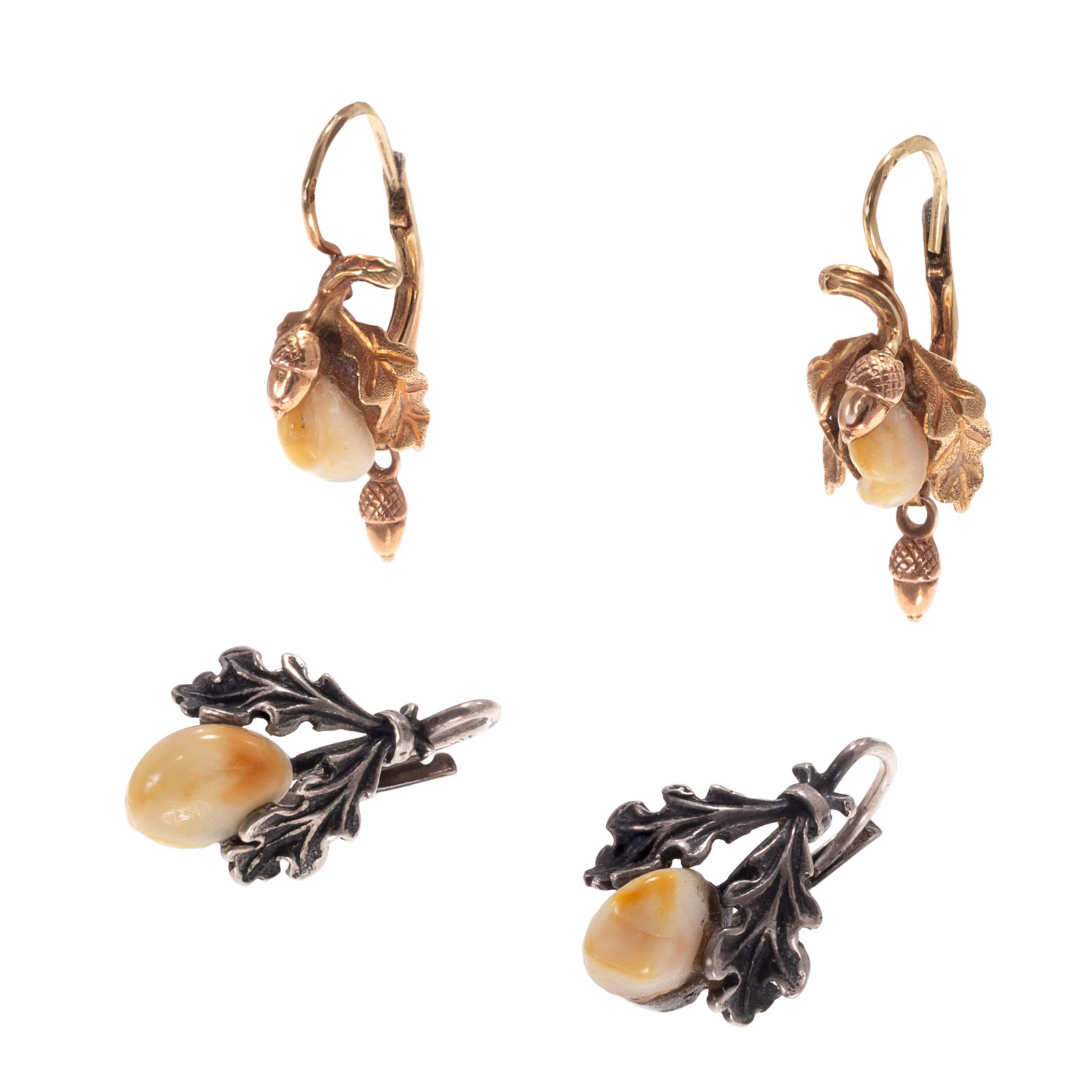 Two Pairs of Bavarian Huntsman Deer Tooth, 14k, Silver Earrings: Two Pairs of Bavarian Huntsman Deer Tooth, 14k, Silver Earrings Including one pair featuring a deer tooth within a 14k yellow gold foliate earring mounting, together with one featuring a deer tooth fl