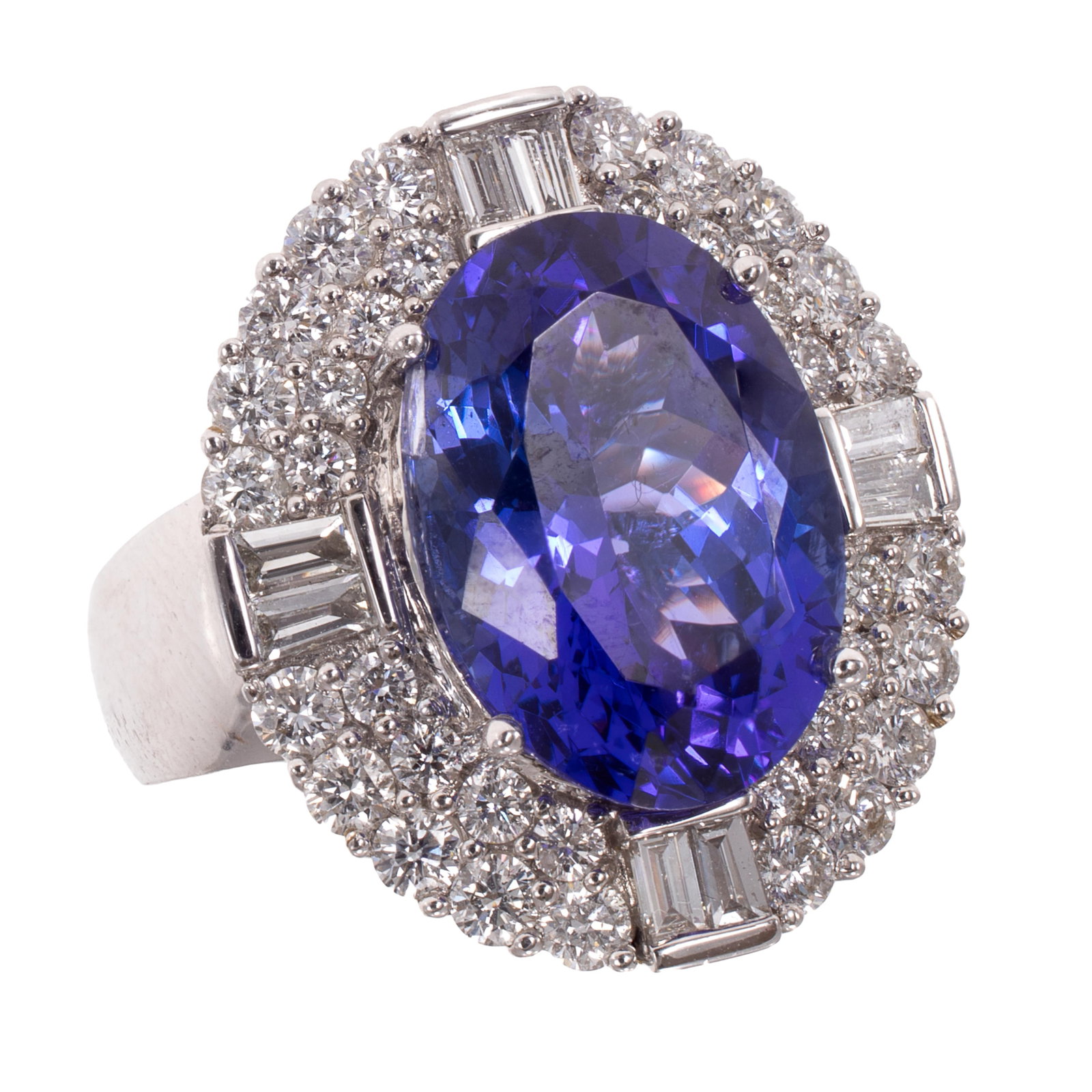Tanzanite, Diamond, 18k White Gold Ring, Iliana: Tanzanite, Diamond, 18k White Gold Ring, Iliana Centering one oval-cut tanzanite weighing approximately 8.19 cts., accented by forty-four round brilliant-cut and baguette-cut diamonds weighing a