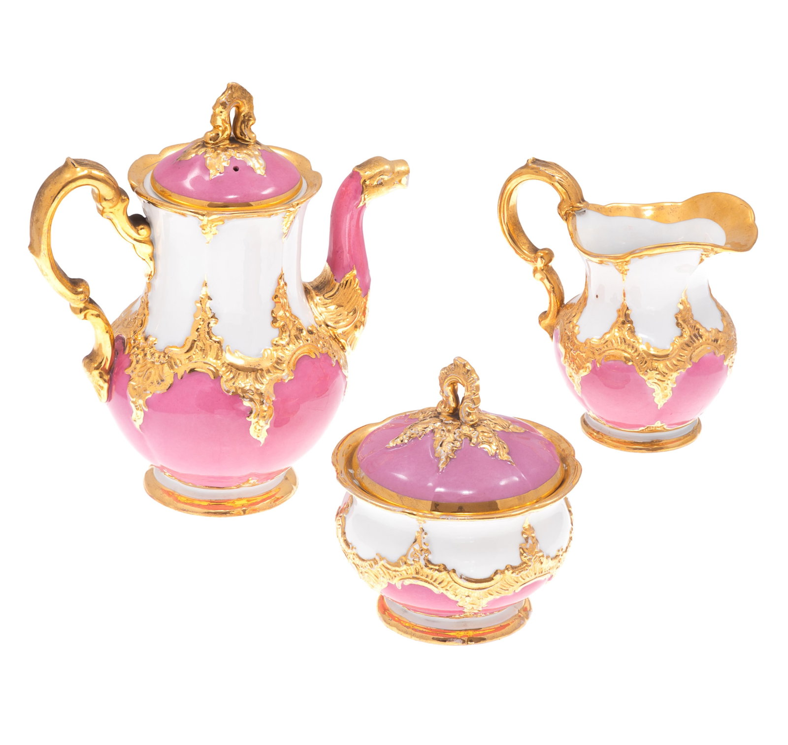 Meissen Porcelain Tea Set: Meissen Porcelain Tea Set Three pieces, a tea pot 9in (22cm) h. a covered sugar bowl 5 1/2in (14cm) and creamer 4 1/2in (11cm). All with gilt rocaille decoration on a Rose de Pompadour glaze, the tea 