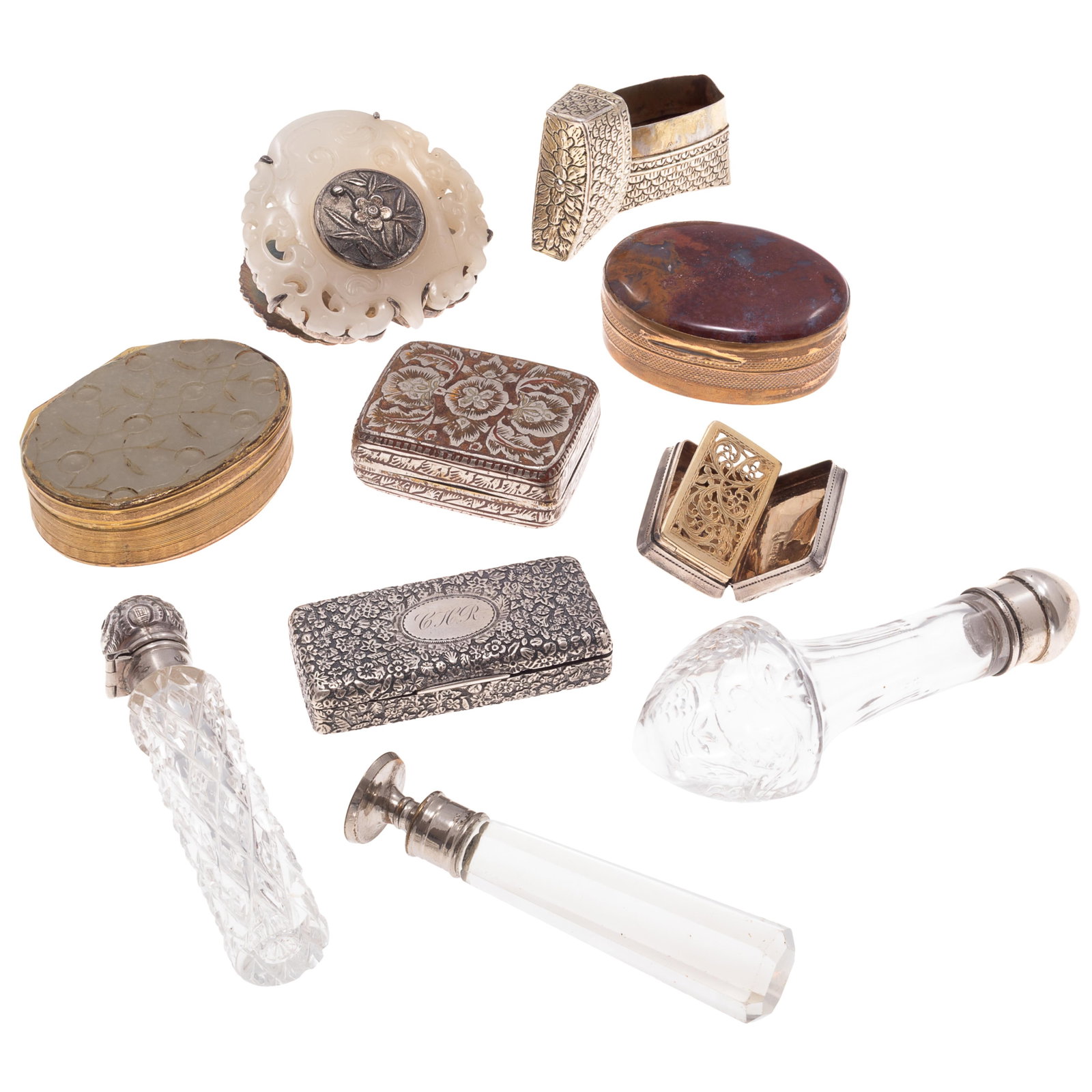 Victorian Vinaigrettes: Victorian Vinaigrettes A Collection of glass, sterling, and silver metal containers to overcome moments of unpleasantness. Including Three glass bottles with silvered tops, one engraved L.C. 1893, One