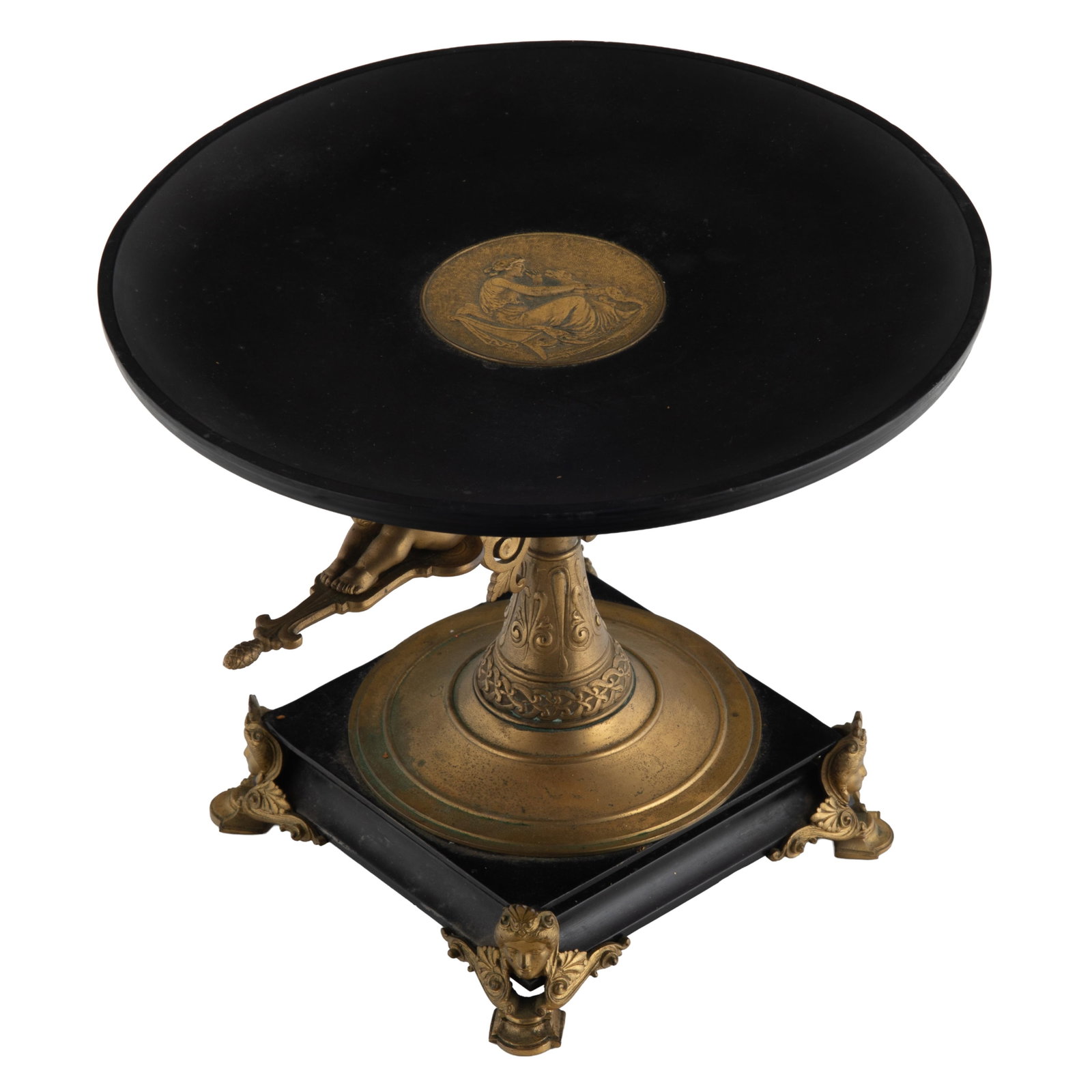 Victorian Tazza: Victorian Tazza The slate dished top centering a gilt medallion depicting Diana and a hound supported on and backs of putto raised on a tapering standard on a square base with Pharaonic mask feet.