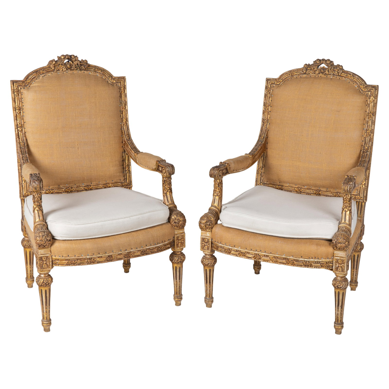 Pair Louis XVI Style Giltwood Armchairs: Pair Louis XVI Style Giltwood Armchairs Each with an arched crest with a central floral coronet with bead and reel carved arms ending in acanthus carved terminals raised on tapering reeded legs,