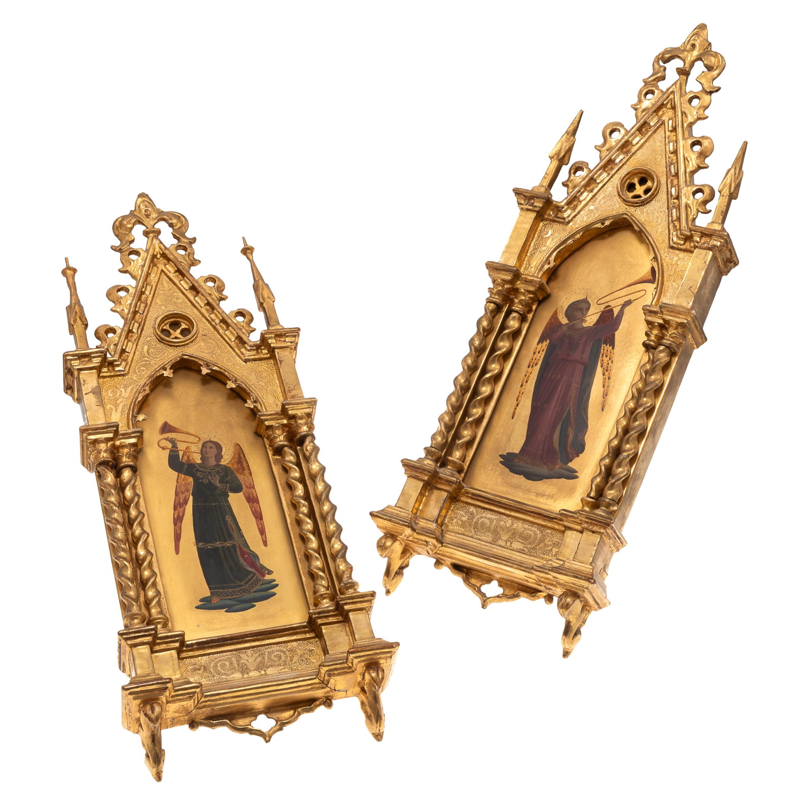 Pair of Gothic Revival Giltwood Devotional Paintings: Pair of Gothic Revival Giltwood Devotional Paintings The central painted panel depicting Gabriel with a trumpet within an arched and trefoil carved frame surmounted by a Fleur de Lys and spires. 22in