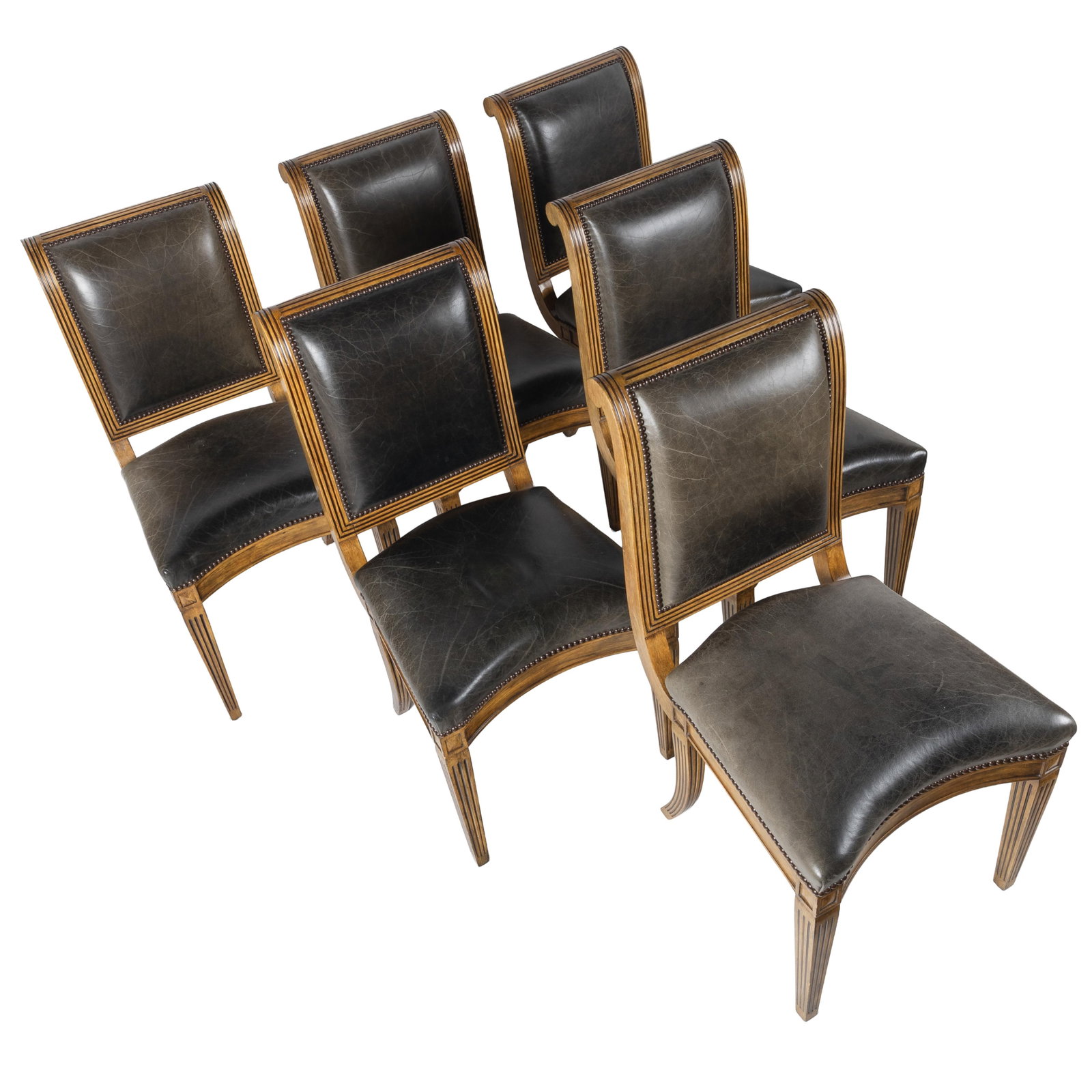 Six Neoclassical Style Dining Chairs, Michael Taylor Design: Six Neoclassical Style Dining Chairs Michael Taylor Design Each reeded carved frame with a raked back with rolled crest and shaped seat, leather upholstered with nail head trim, raised on tapering leg