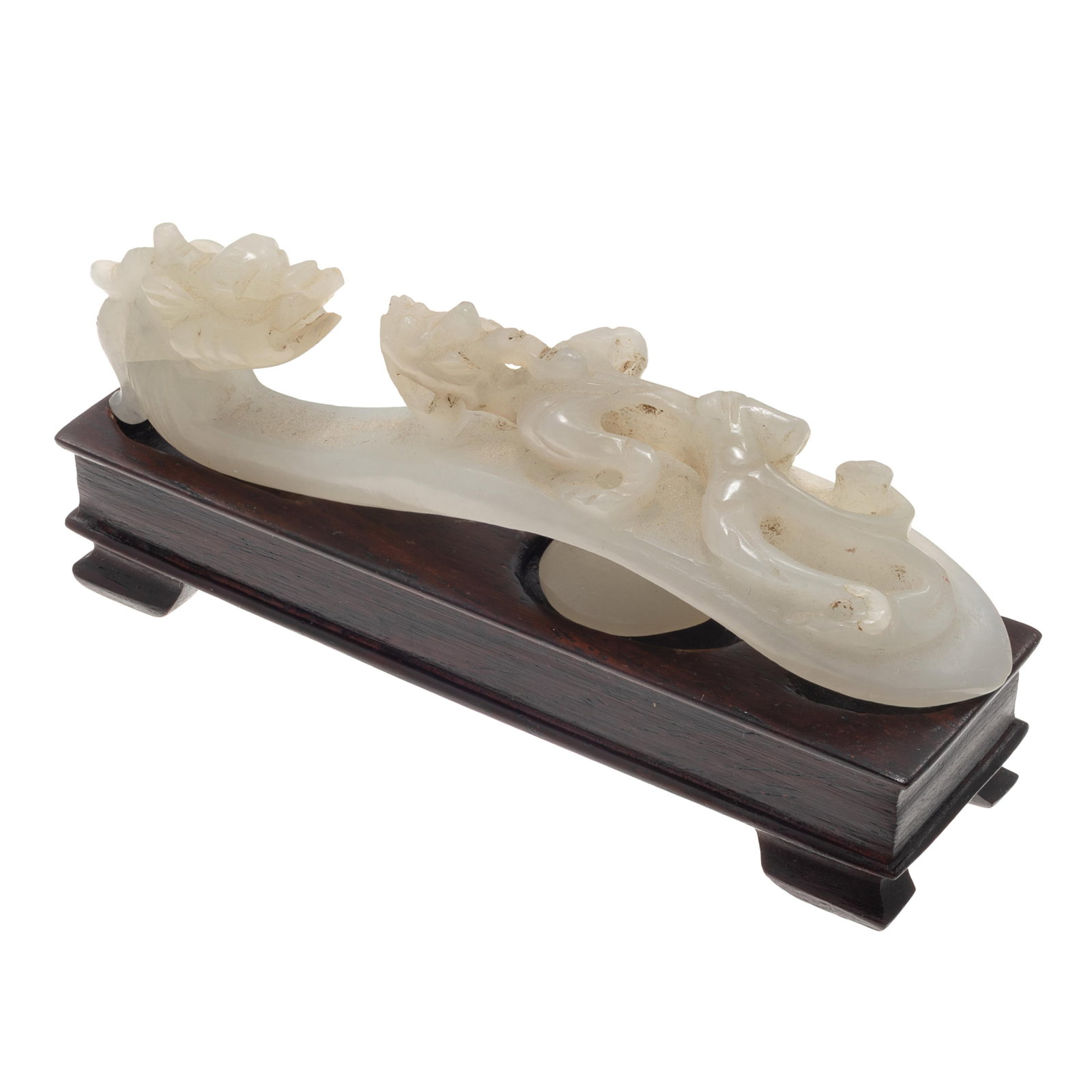 Chinese Carved Jade Belt Hook with Stand: Chinese Carved Jade Belt Hook with Stand The jade belt hook carved as a dragon gazing at a striding beast, measuring approximately 3.33 x 0.90 in (8.45 x 2.00 cm). Accompanied by a fitted wood stand. 