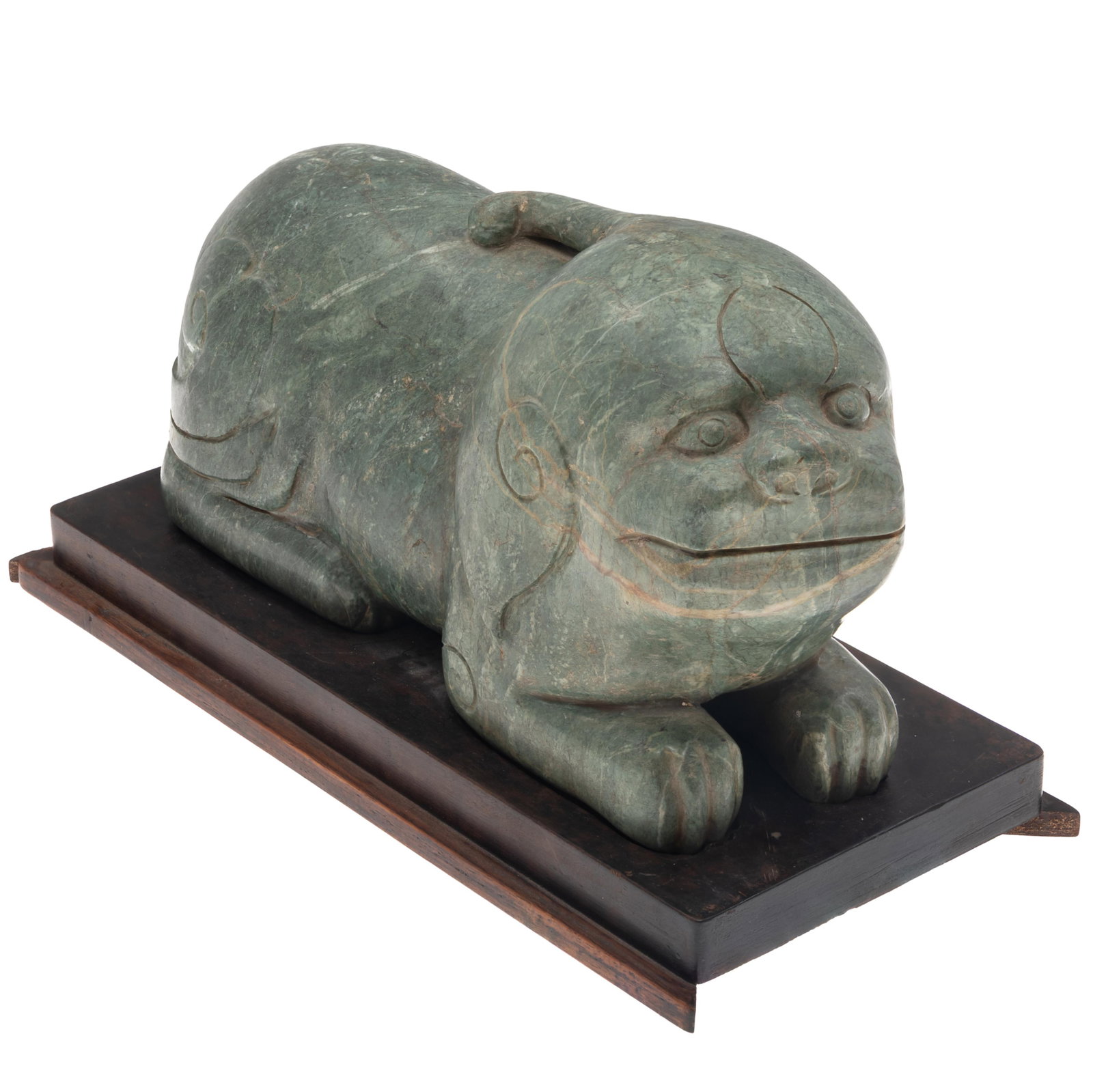 Large Chinese Spinach Green- Grey Hardstone Figure of a Mythical Beast: Large Chinese Spinach Green- Grey Hardstone Figure of a Mythical Beast 20th Century. Powerfully carved from a single block of stone depicting a recumbent mythical beast, The stone shown mottled spinac