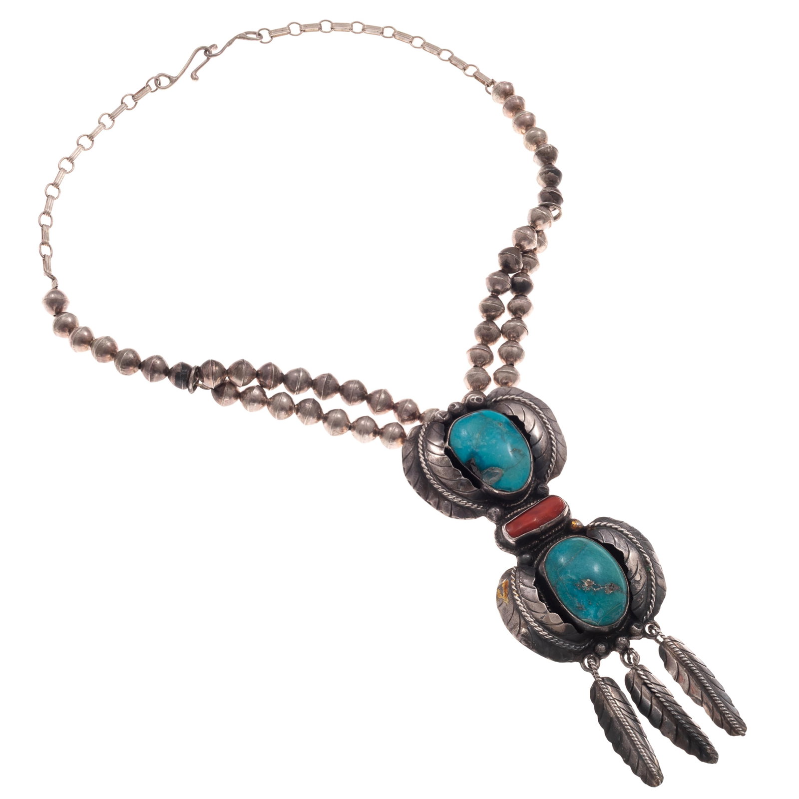 Navajo Turquoise, Coral, Sterling Silver Necklace: Navajo Turquoise, Coral, Sterling Silver Necklace Featuring two turquoise cabochons centered by one branch coral, set in a feather motif, sterling silver pendant mounting measuring approximately 4.45 