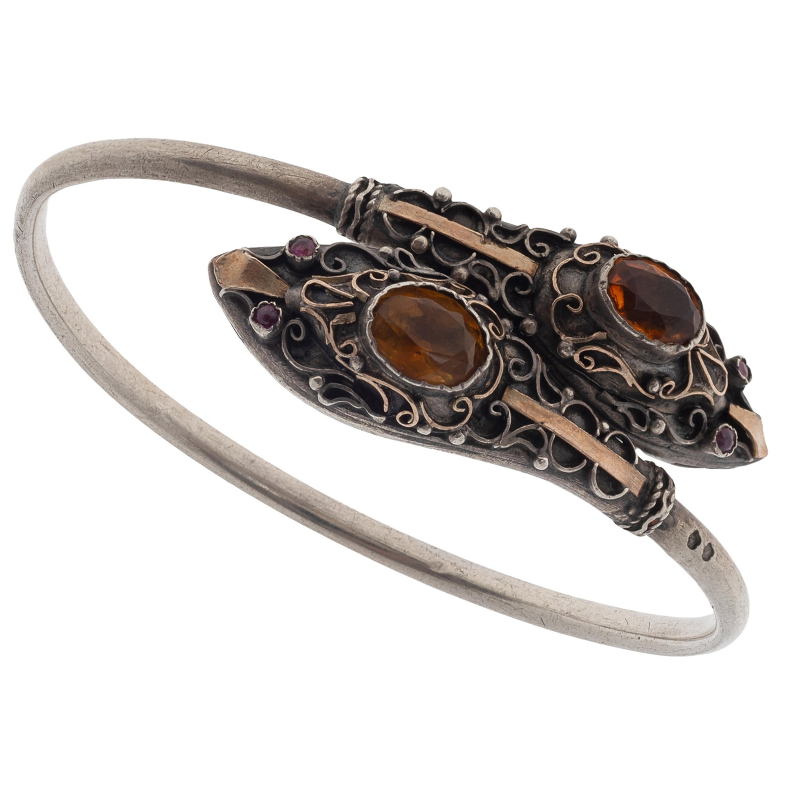 Antique French Citrine, Ruby, Silver 'Snake' Bracelet: Antique French Citrine, Ruby, Silver 'Snake' Bracelet Designed as a double headed snake, each head featuring one oval-cut citrine and two round-cut ruby eyes, all highlighted by applied wire work and 