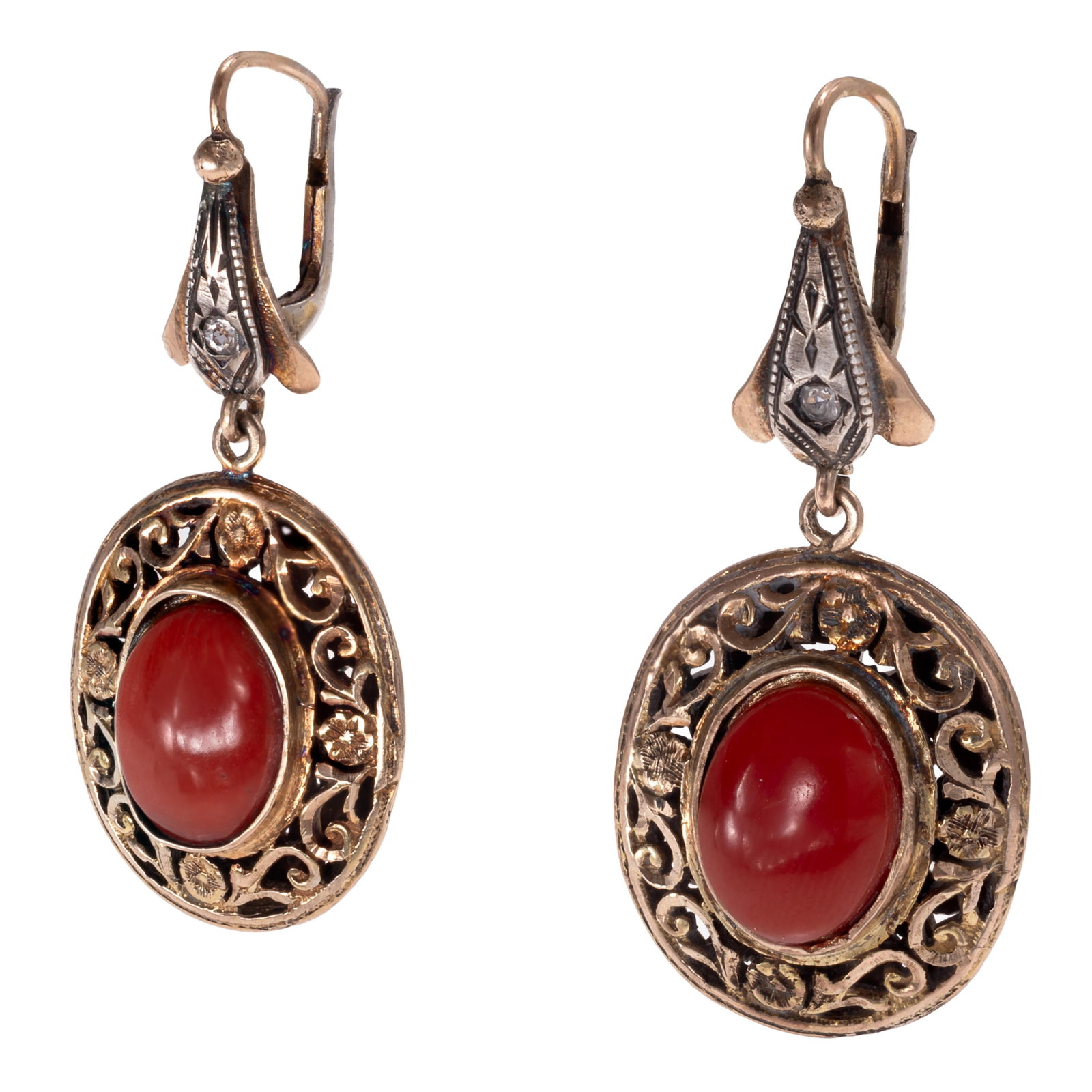 Pair of Coral, Diamond, 10k Yellow Gold Earrings: Pair of Coral, Diamond, 10k Yellow Gold Earrings Centering one oval coral cabochon measuring approximately 12.0 x 9.0 mm, accented by one round-cut diamond weighing approximately 0.02 ct., set in a fo