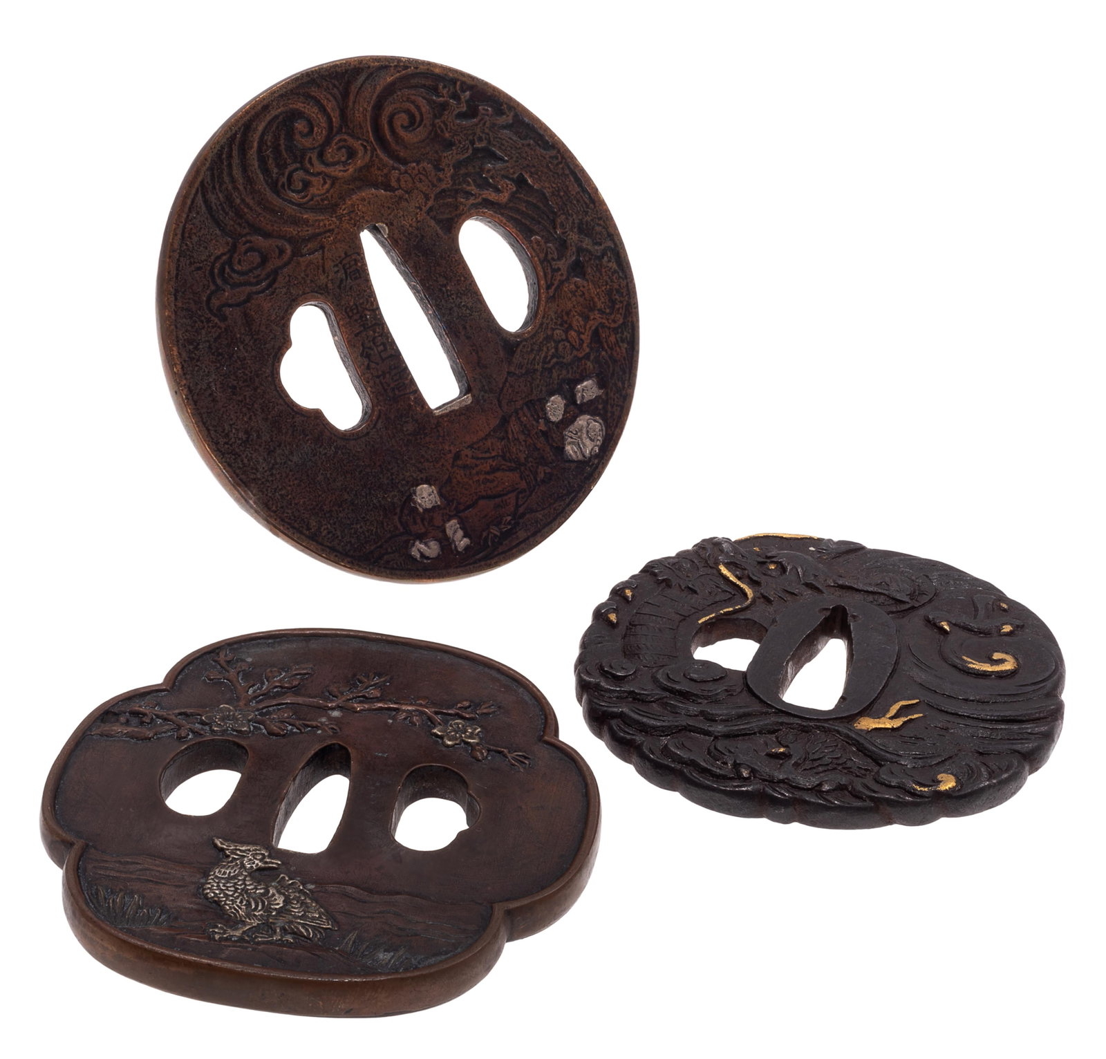 Group of Three Japanese Mixed Metal Tsuba: Group of Three Japanese Mixed Metal Tsuba Meiji period. Comprising: First is a circular Tsuba with waves and demon and figures. Iron with copper and silver inlay. Decorated with turbulent waves and fl