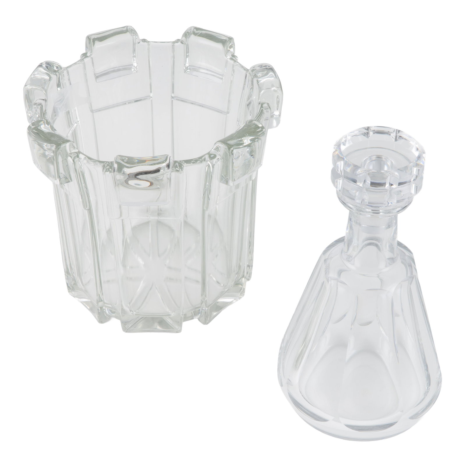 Baccarat Modernist Decanter: Baccarat Modernist Decanter The stopper with geometric cuts over the bell shape lobed decanter. 9 1/2in (25cm) h. Together with a Modernist Ice bucket, Slovenia 7 1/2in h. (8in (20cm) d