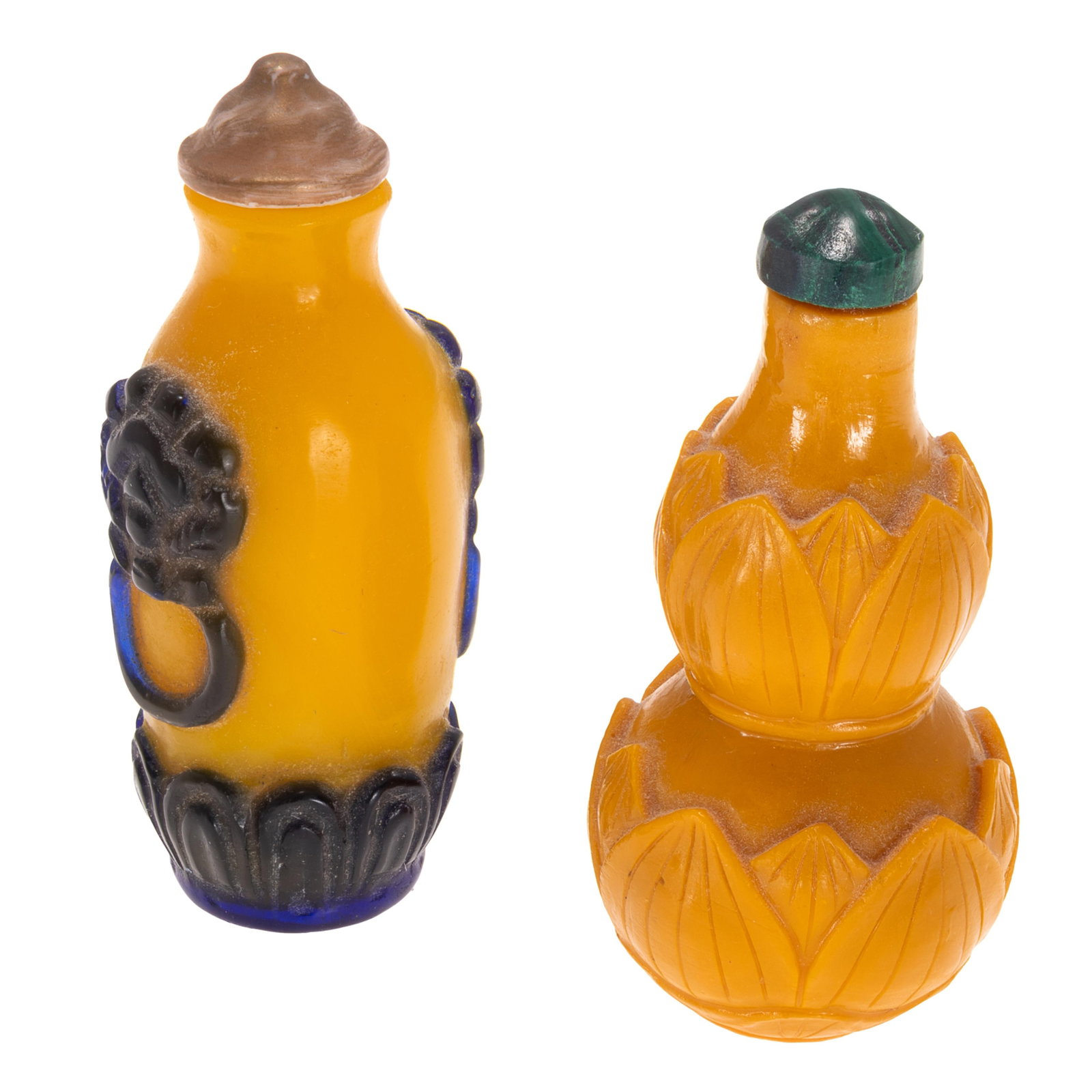Two Chinese Yellow Peking Glass Snuff Bottles: Two Chinese Yellow Peking Glass Snuff Bottles Comprising: First is a imperial yellow Peking glass overlay bottle with tall cylindrical form , carved with dark green lotus base and mask form handles