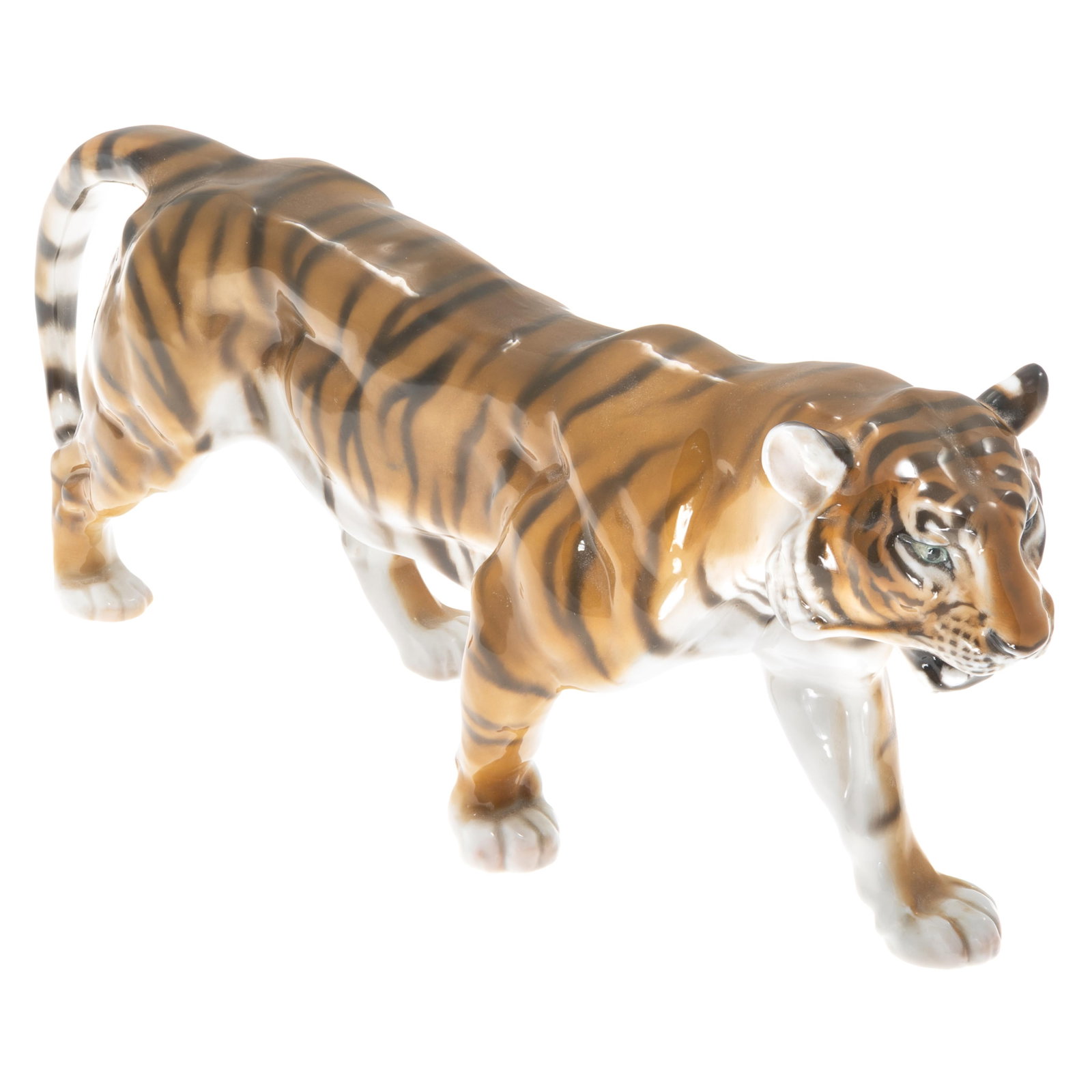 Rosenthal Porcelain Tiger Figure: Rosenthal Porcelain Tiger Figure Modeled in a stalking posture. Marked Rosenthal Germany on base 7in (18cm) h. 15in (39cm) l. Condition: small hole on foot on base