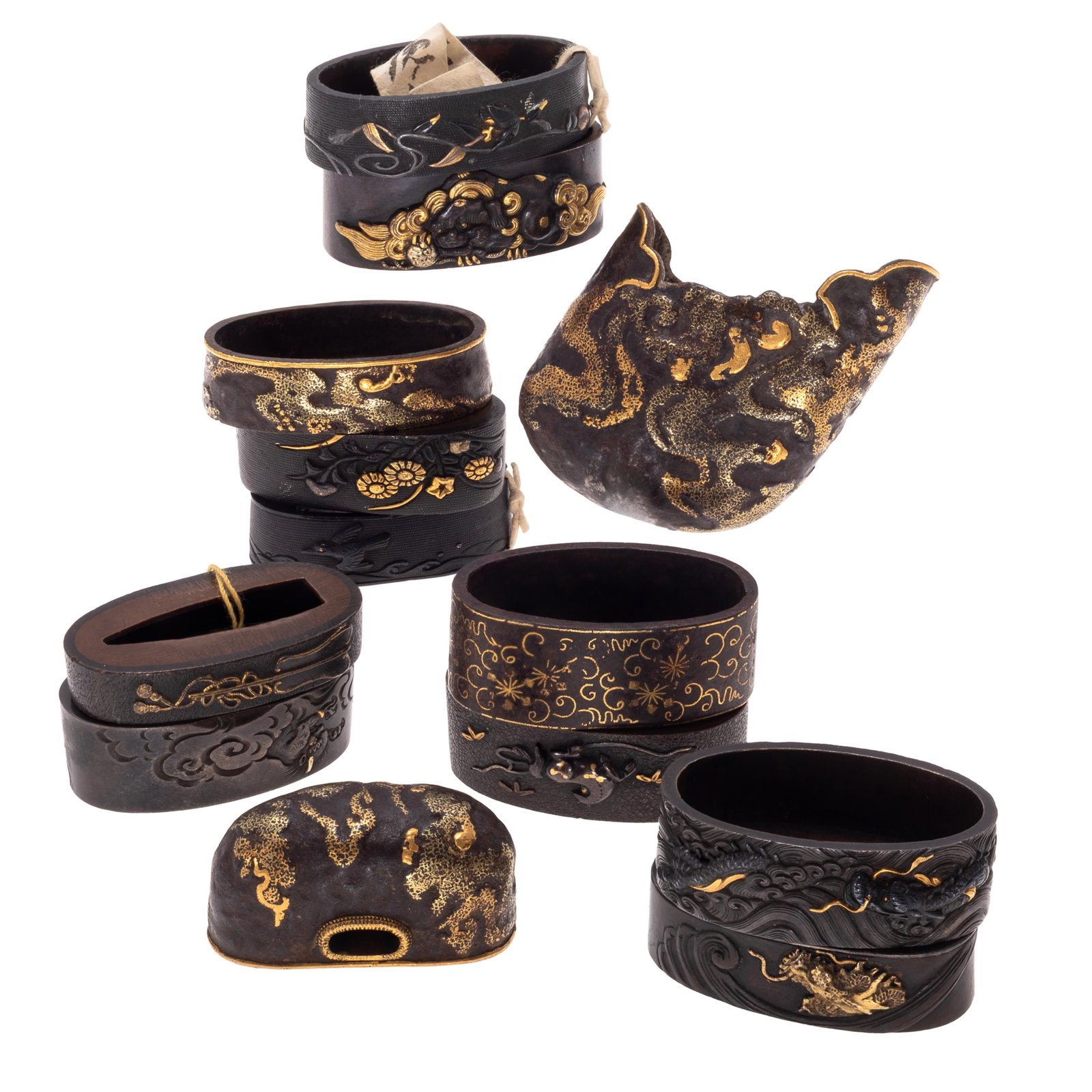 Large group of Japanese Fuchi and Kashira Sword Fittings: Large group of Japanese Fuchi and Kashira Sword Fittings Edo to Meiji period. Comprising 13 iron copper alloy Fuchi and Kashira for katana handles. Decorative collars and pommels with gold inlay, with