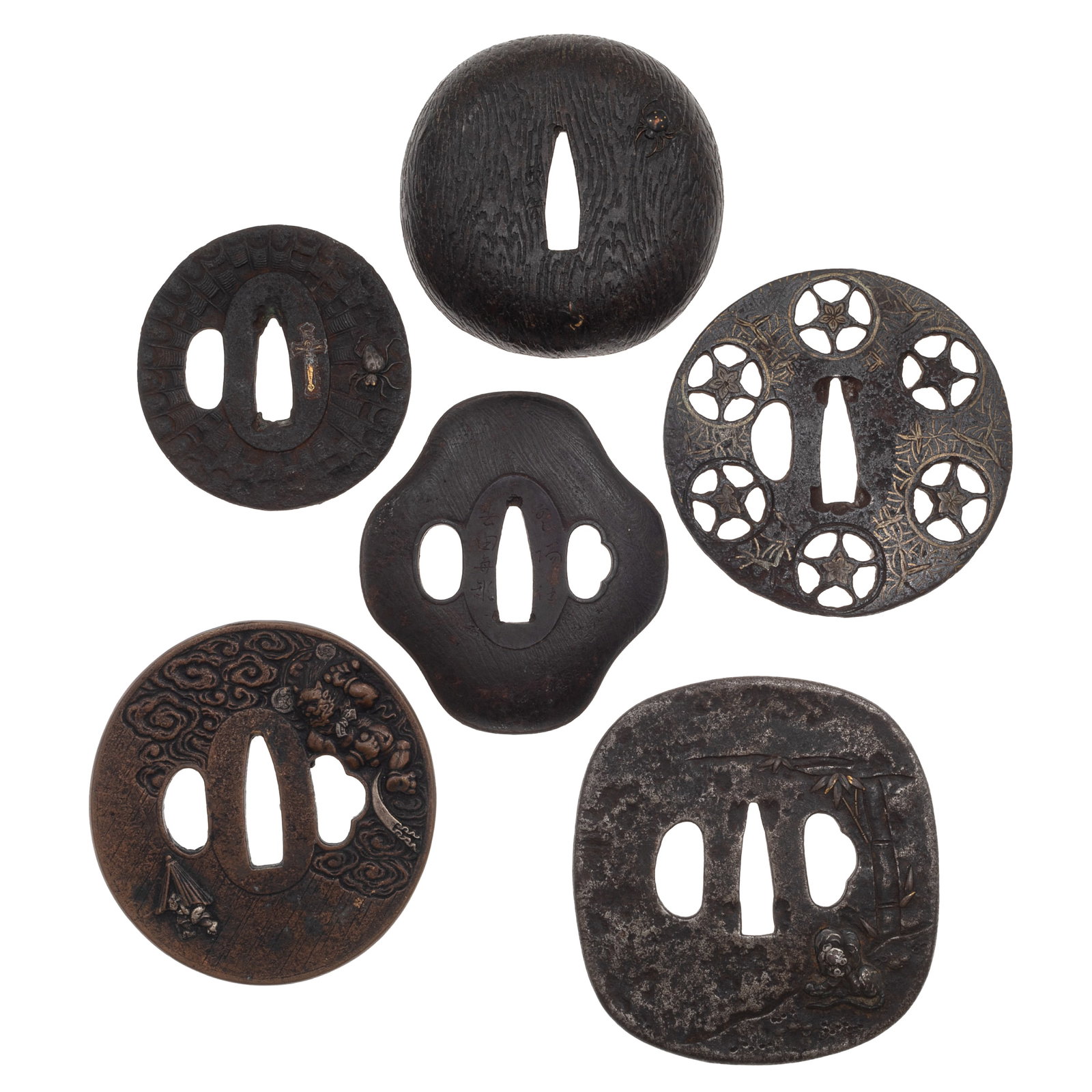 Group of Japanese Tsuba and Sword fittings: Group of Japanese Tsuba and Sword fittings Momoyama to Edo period. Comprising six Japanese iron sword guards, tsuba, and sword fittings of varied shapes and decorative styles. First is a signed copper