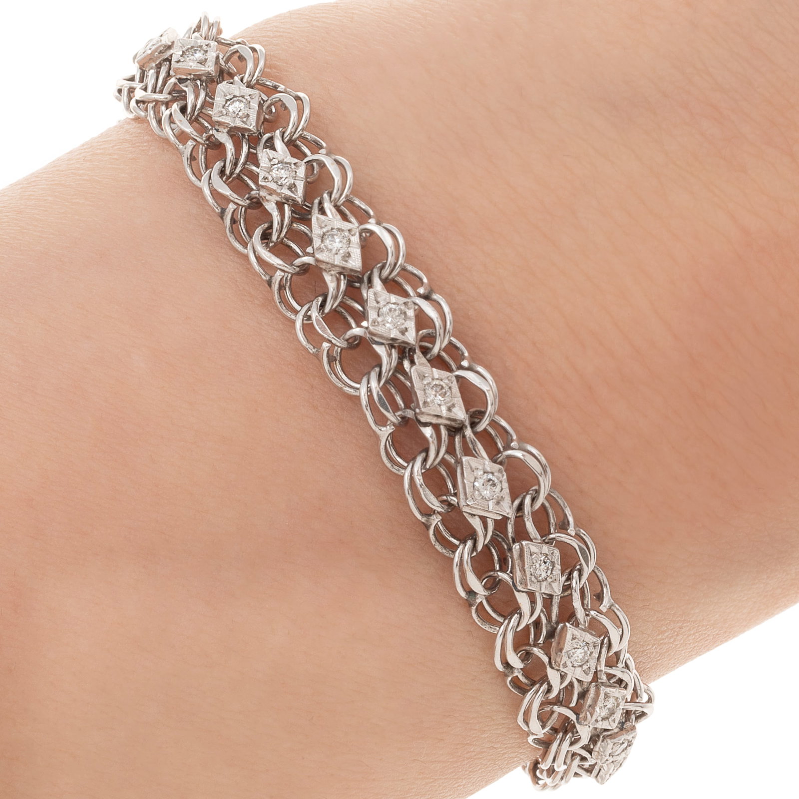 Diamond, 14k White Gold Bracelet: Diamond, 14k White Gold Bracelet Featuring twenty-nine round brilliant-cut diamonds weighing a total of approximately 0.87 cttw., set in a 14k white gold mounting completed by a tongue-and-groove