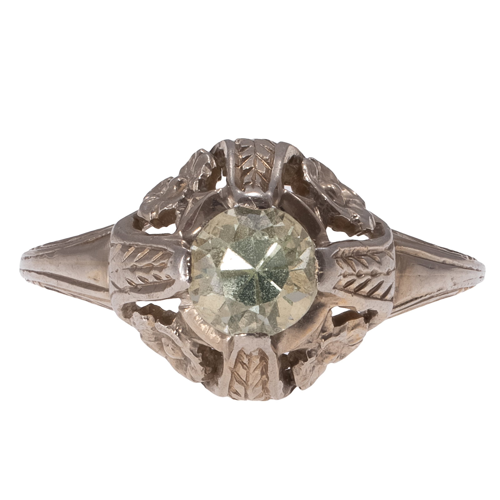 Art Deco Uranium Glass, 18k White Gold Ring: Art Deco Uranium Glass, 18k White Gold Ring Featuring one round-cut uranium glass measuring approximately 5.0 mm, set in a foliate motif, 18k white gold ring mounting, size 5 1/2. Gross weight: 2.5 gr