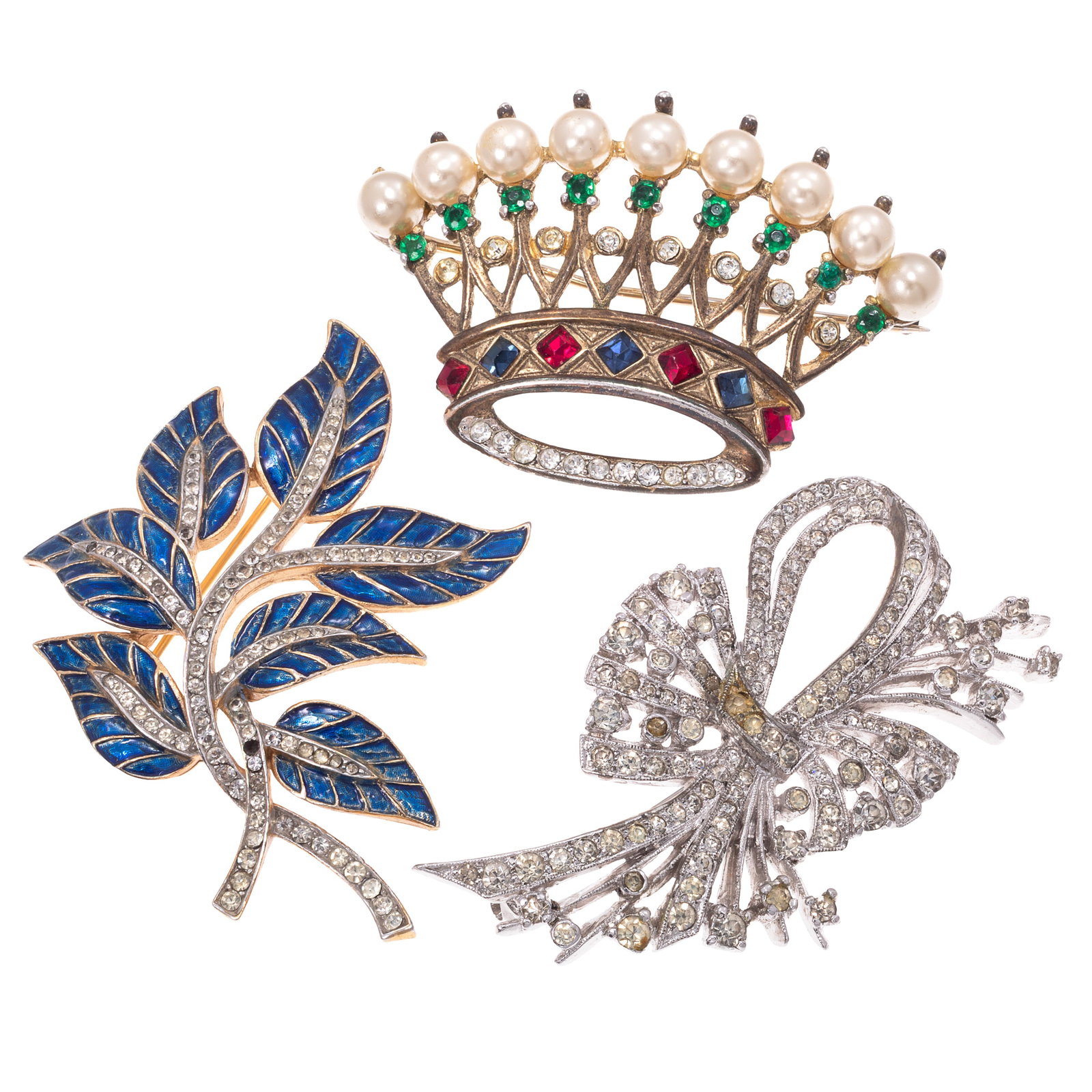 Collection of Three Trifari and Panetta Rhinestone, Enamel Pins: Collection of Three Trifari and Panetta Rhinestone, Enamel Pins Including one glass, rhinestone, simulated pearl, sterling silver 'crown' pin, Trifari; one rhinestone, blue enamel spray pin, Trifari; 
