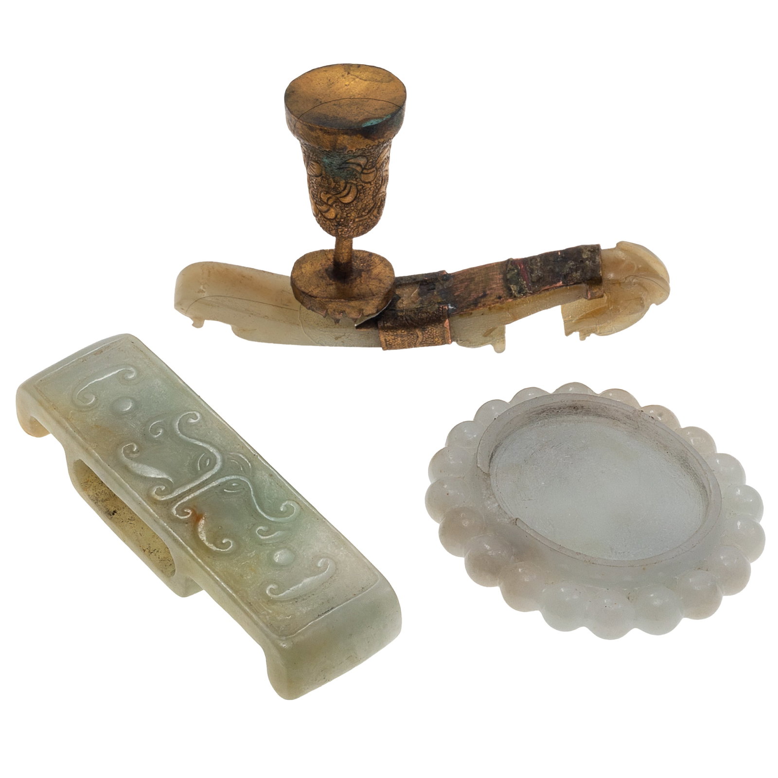 Three Chinese Jade Hardstone Carvings: Three Chinese Jade Hardstone Carvings Including a carved jade dragon head belt mounted on a gilt metal fitting. Condition: Jade broken and repaired. An oval form white jade buckle with beaded edge. Co