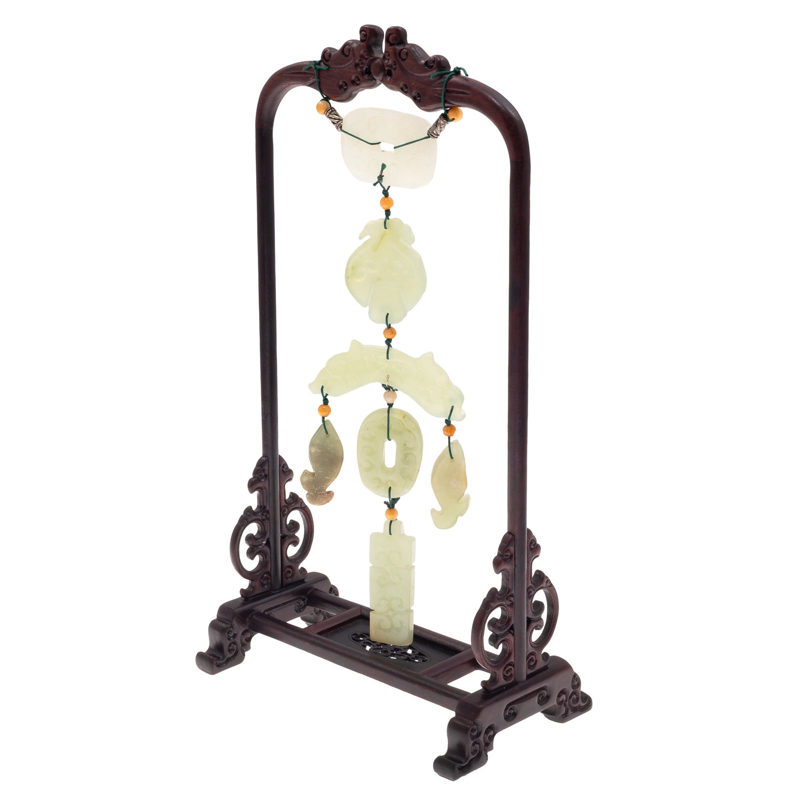 Group of Chinese Carved Jade Hardstone Pendants: Group of Chinese Carved Jade Hardstone Pendants A group of Chinese carvered jade, serpentine pendants, including celadon and white colored hard stone carvings in various forms, suspended as a decorati