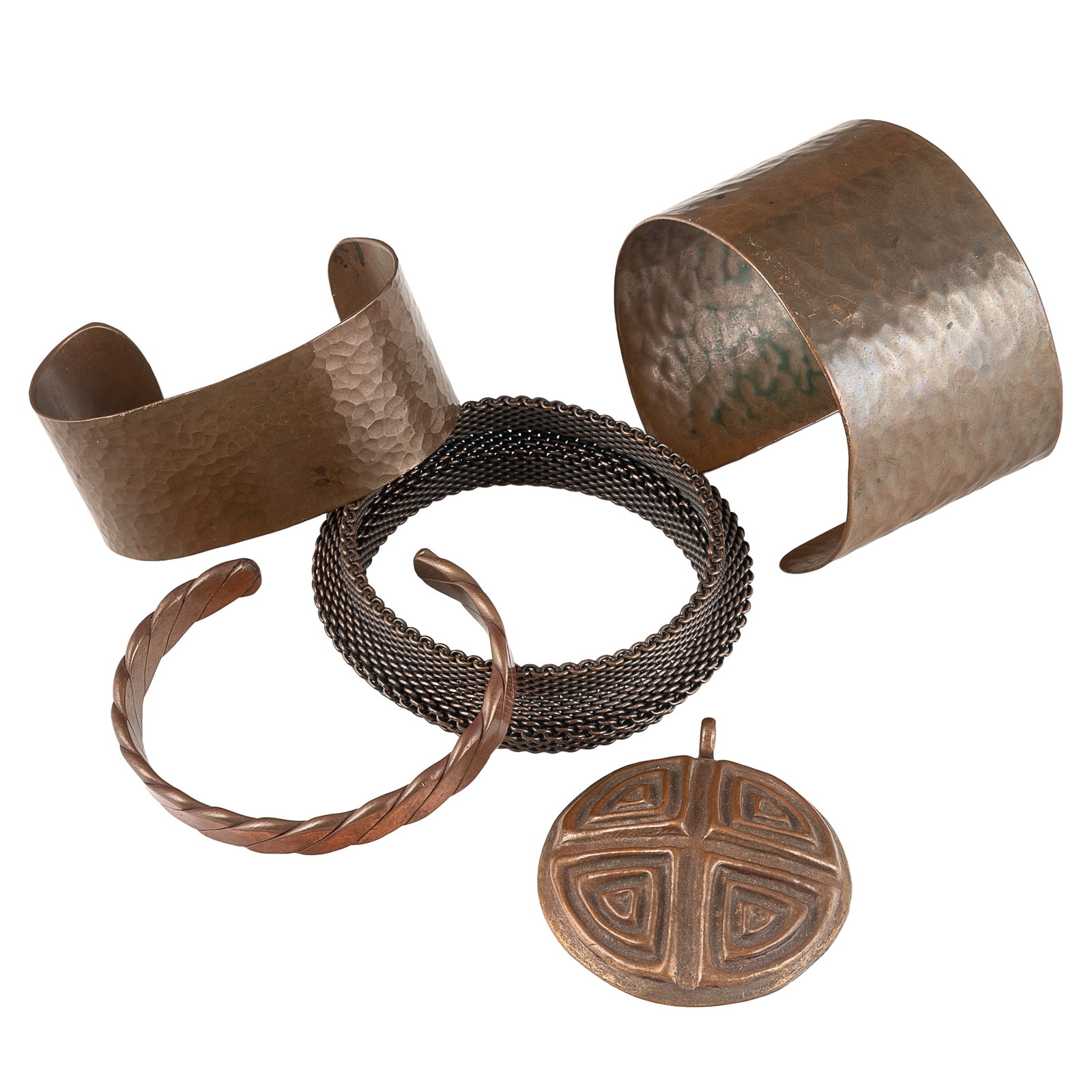 Copper Jewelry Group: Copper Jewelry Group Group of copper jewelry, comprising two hammered copper cuff bracelets, a copper mesh bracelet, a twisted copper cuff bracelet, and a four blessings charm. Five pieces total.