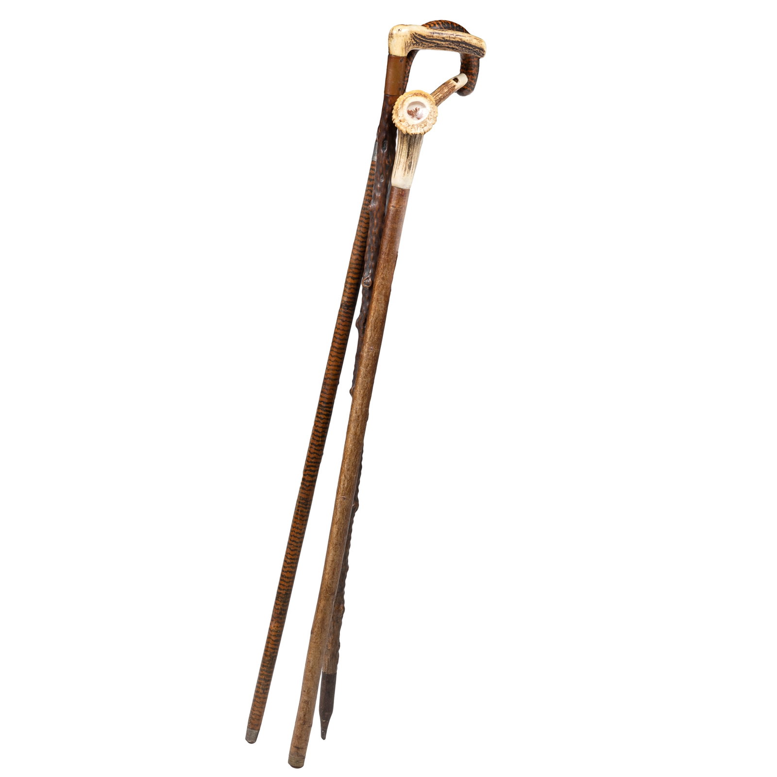 Antler Handled & Painted Canes: Antler Handled & Painted Canes Two antler handled canes, one with a window into the antler knob, revealing a small piece of foliage, the other with large copper collar and a knotty wooden shaft.