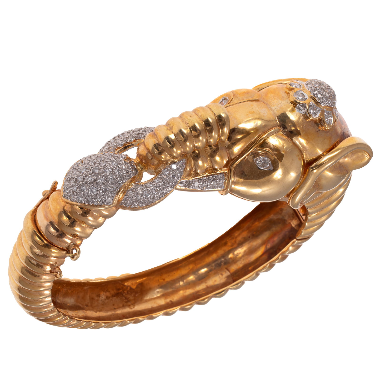 Diamond, 18k Yellow Gold Elephant Bracelet: Diamond, 18k Yellow Gold Elephant Bracelet Designed as an elephant, featuring numerous round brilliant-cut diamonds weighing a total of approximately 1.00 cttw., set in a ribbed, hinged, 18k yellow