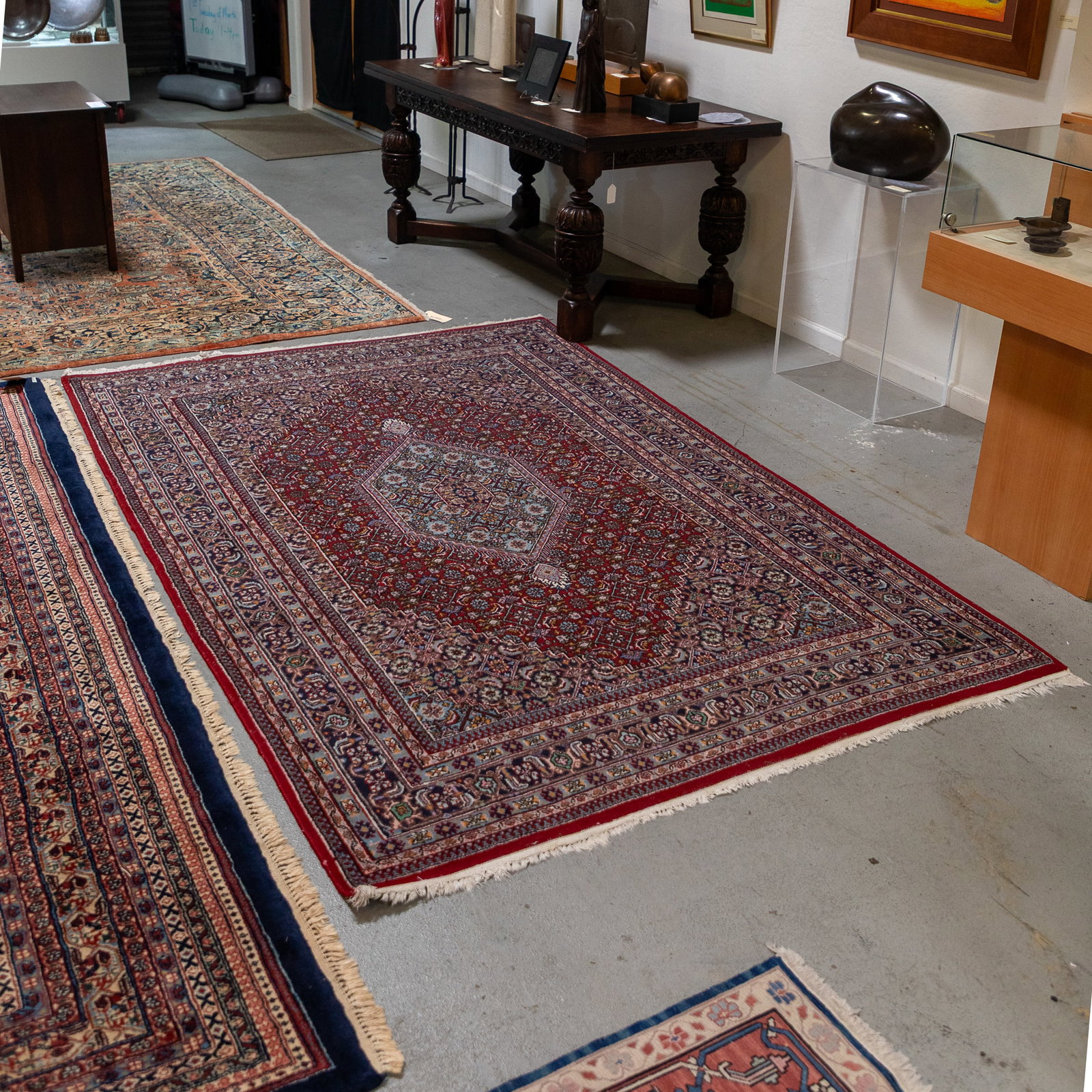 Bidjar Persian Rug.: Bidjar Persian Rug. With a central diamond form medallion within a floral decorated burgundy ground. 67in. x 102in