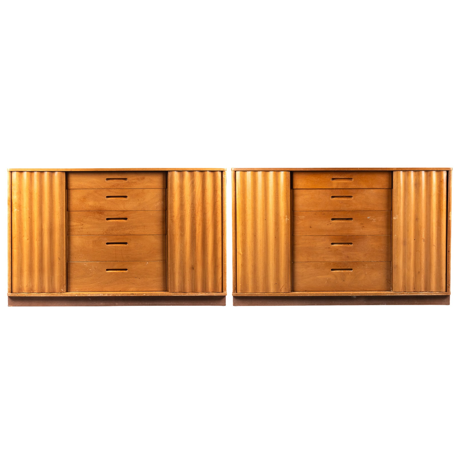 Pair of Edward Wormley (1907-1995) for Dunbar Cabinets: Pair of Edward Wormley (1907-1995) for Dunbar Cabinets Each with a rectangular top over five central drqwers flanked by scalloped sliding doors. 32in (82cm) h. 49in (125cm) w. 20in (51cm) d