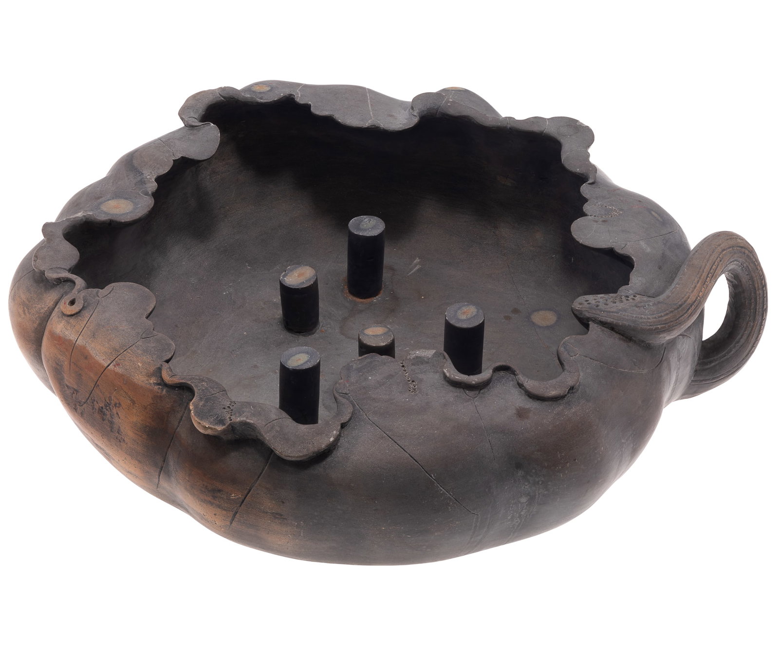 A Chinese Carved Duan Stone Lotus Leaf Brush Washer, Signed Shizhuzhai: Naturalistically carved from Duan stone in the form of a furies lotus leaf, with overlapping lobed edges, a curved stem-form handle and several cylindrical supports rising from the interior. The