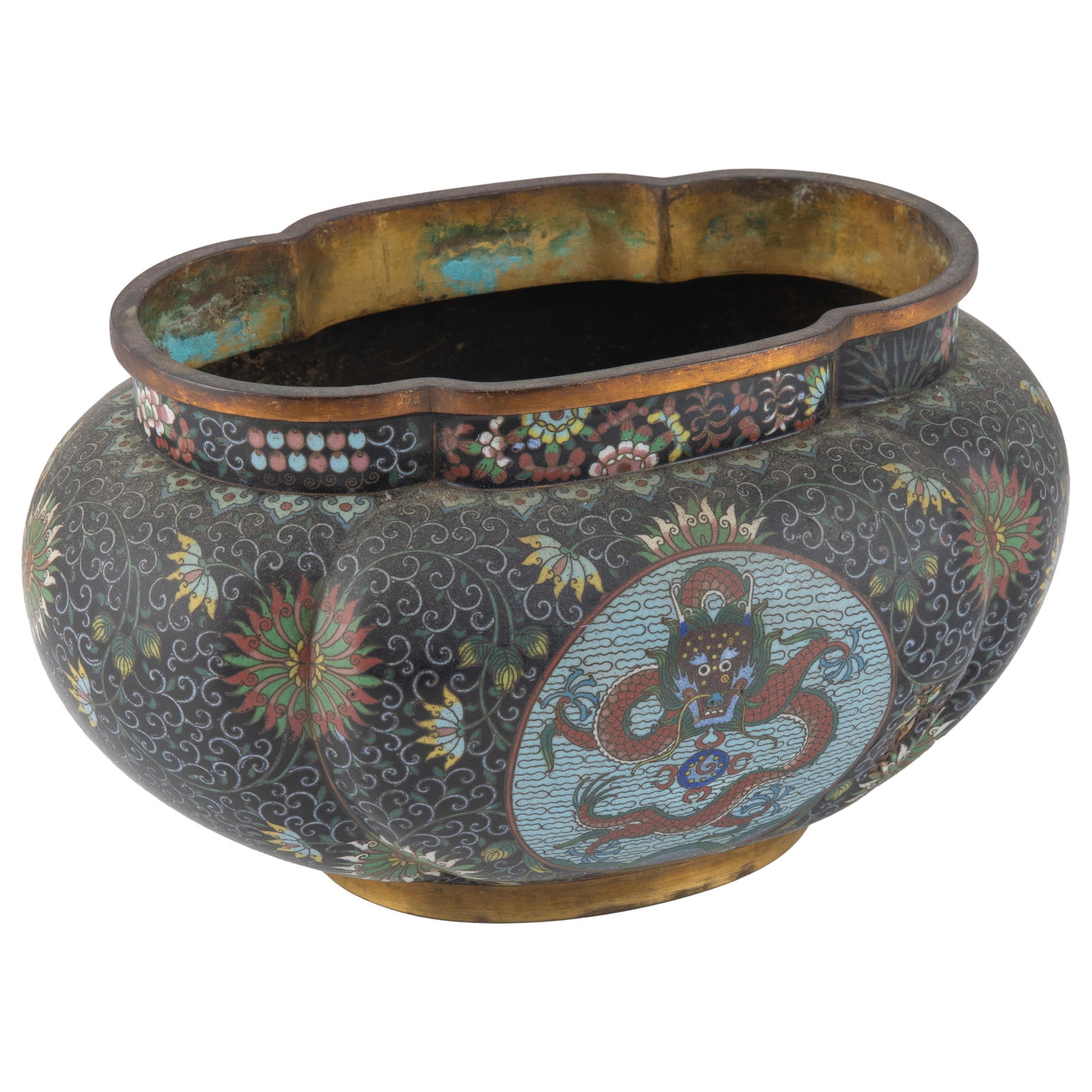 Chinese Cloisonne Enamel Jardiniere: Chinese Cloisonne Enamel Jardiniere Late 19th Century Of compressed lobed quatrefoil form, The exterior is decorated against a midnight blue ground with intricate scrolling lotus and stylized