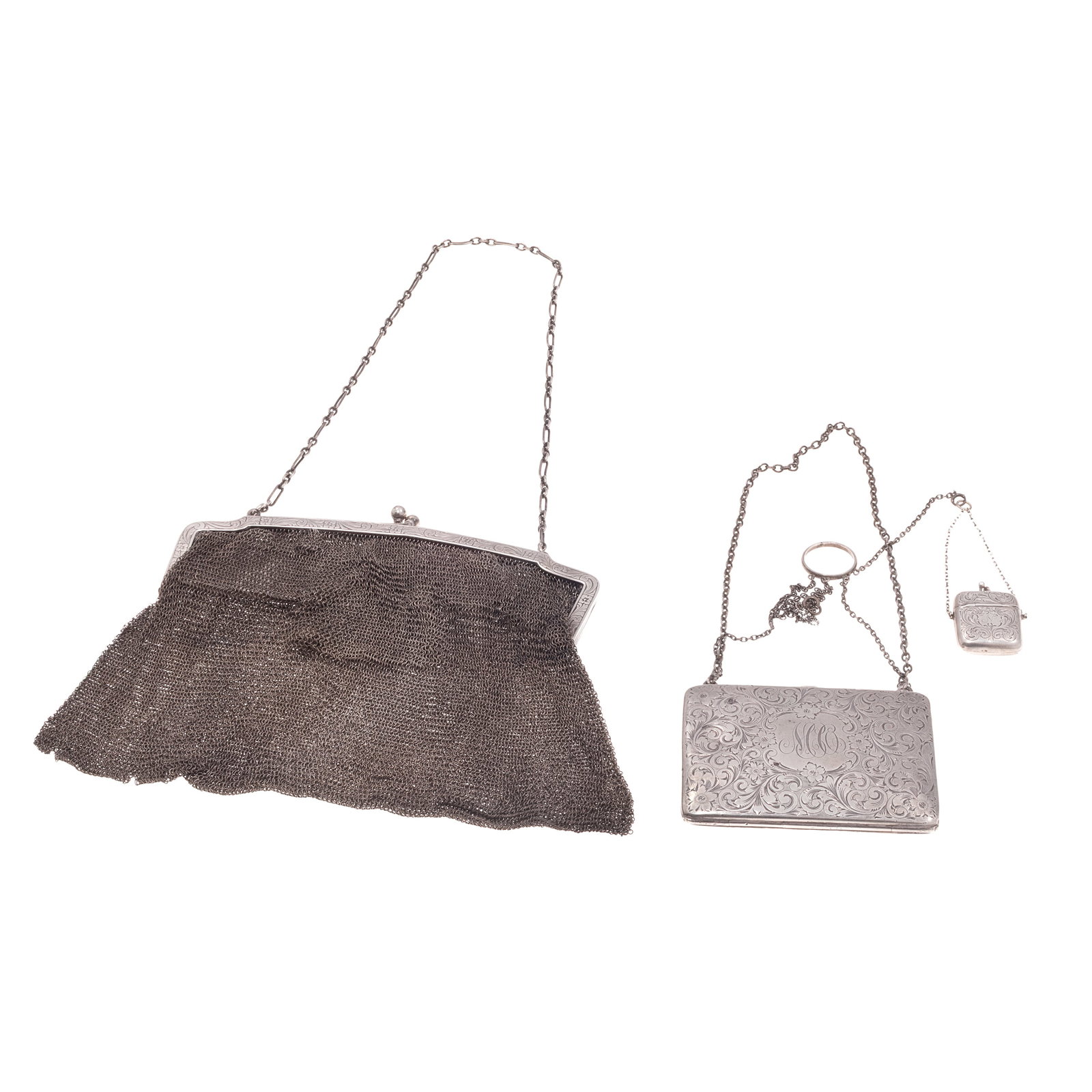 German Art Deco Sterling Evening Bag and Accessories: German Art Deco Sterling Evening Bag and Accessories The silver mesh bag with sterling frame opening to vanity compartments, a mirror, and coin purse 6in x 6 1/2in (15cm. x 17cm) Together with a sterl
