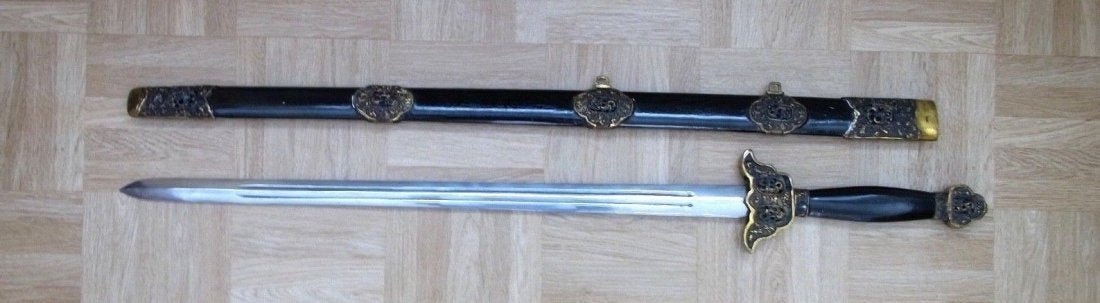 Chinese Antique Long Jian Sword: Chinese Long Jian Sword. 19/20 TH C. Probably earlier blade. Beautiful scabbard parts. Very strong Damascus steel fighting blade. Length: 94/110 cm.