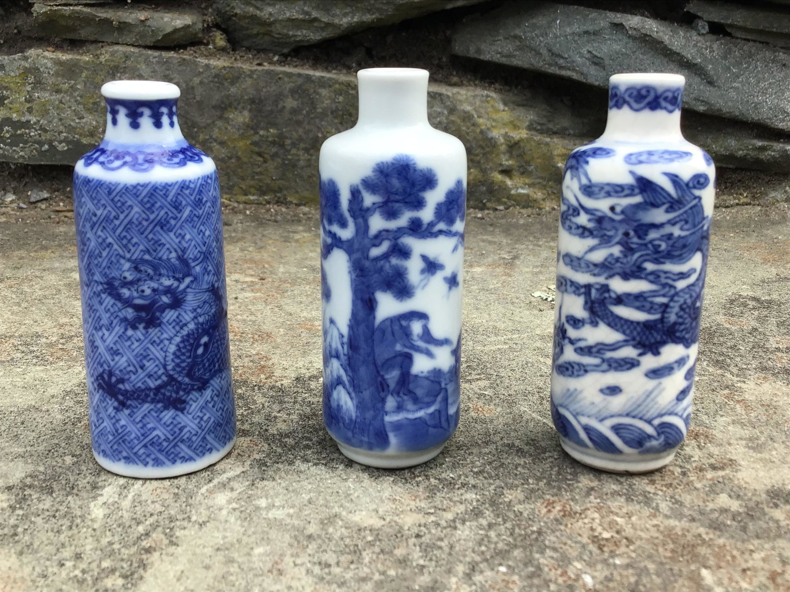 Lot of three Chinese Blue & White Snuff Bottles 19th C.: Lot of three Chinese blue and white snuff bottles 19th C.. The lot consists of the following pieces;1) Snuff bottle featuring a monkey, a deer, a bird & insects. Measures 3" tall and 1 1/8" wide. Mark