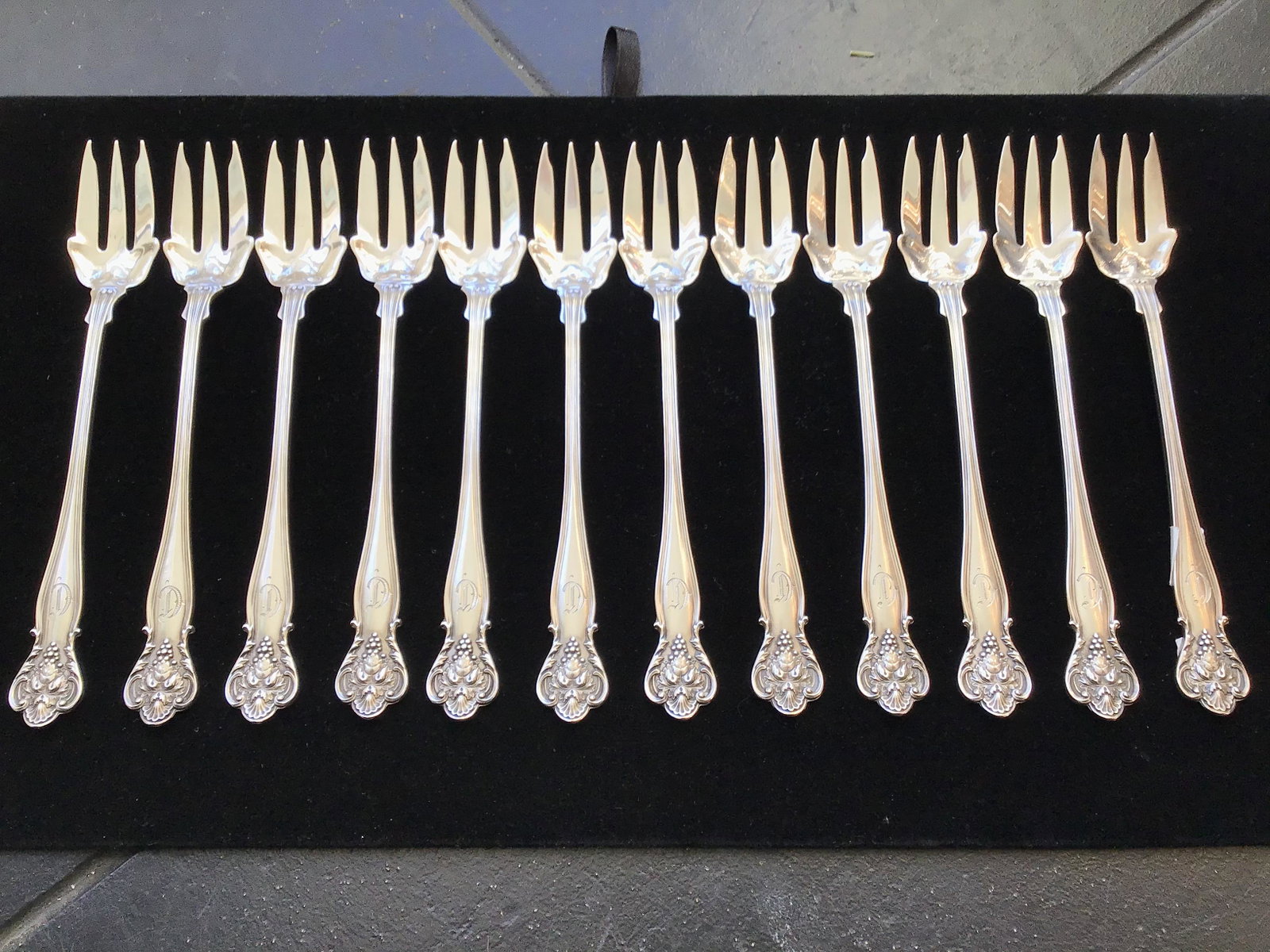 12 Sterling Seafood Forks by Durgin New Vintage Pattern: Set of 12 sterling silver seafood forks by Durgin in the New Vintage pattern first introduced in 1904. each fork measures 5 3/4" long and has a monogram on the top of the handle.