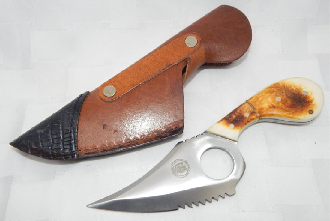 Chipaway Cutlery Hunting Skinning Knife w/ Sheath: Full tang stainless steel blade with finger hole and two-tone leather sheath. Measures 7".