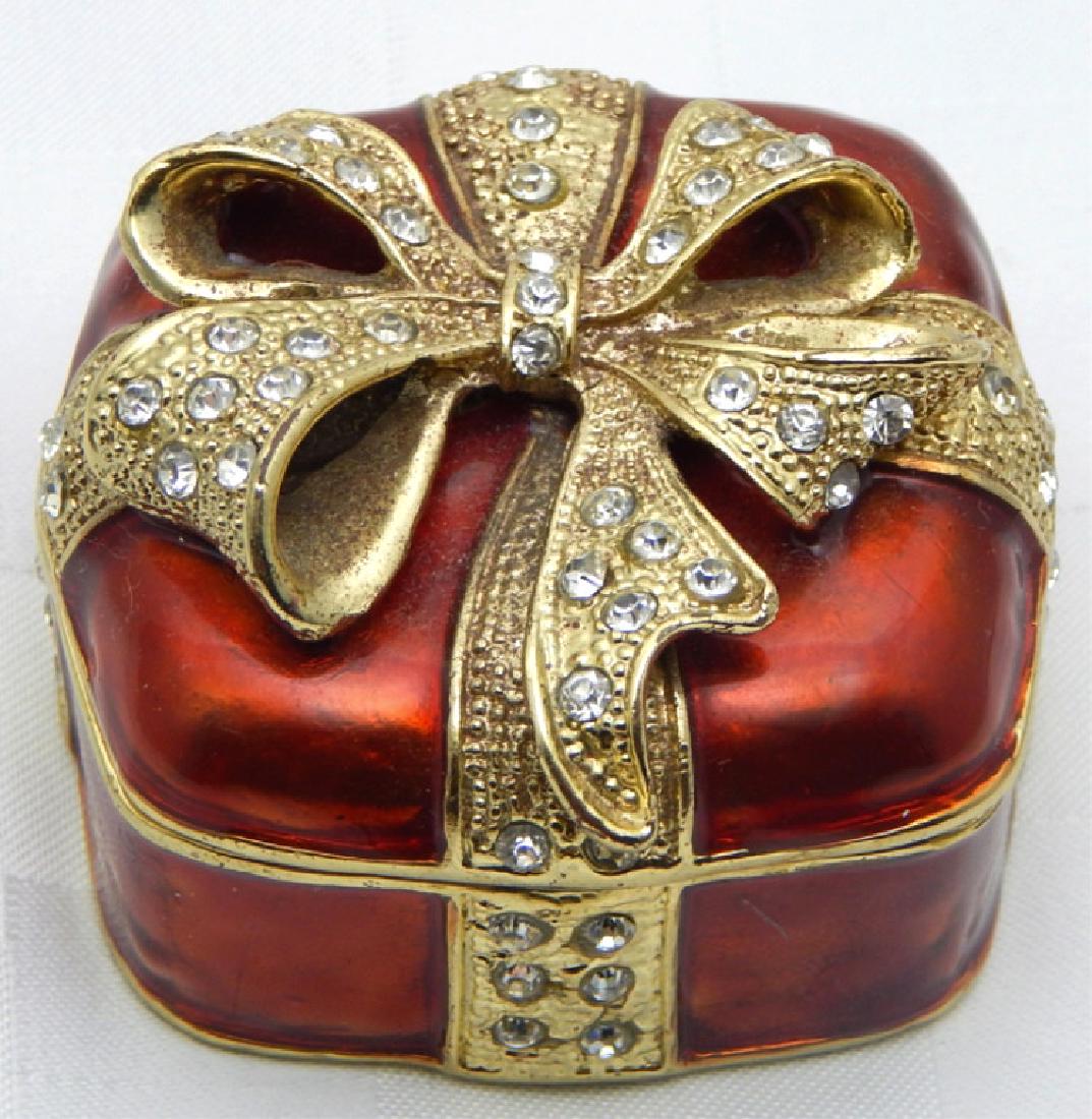 Jeweled Enamel Present Trinket Box: Red and gold enamel with crystals, hinged lid with magnetic closure and enamel interior. Measures 1 1/2" x 2 1/2" x 2 1/2".