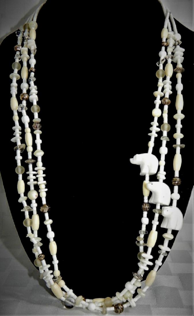 Vintage Christin Wolf Navajo Fetish Necklace: Sterling silver beads along with multi-color and mullti-shaped beads and polar bears. Artist signed Christin Wolf.